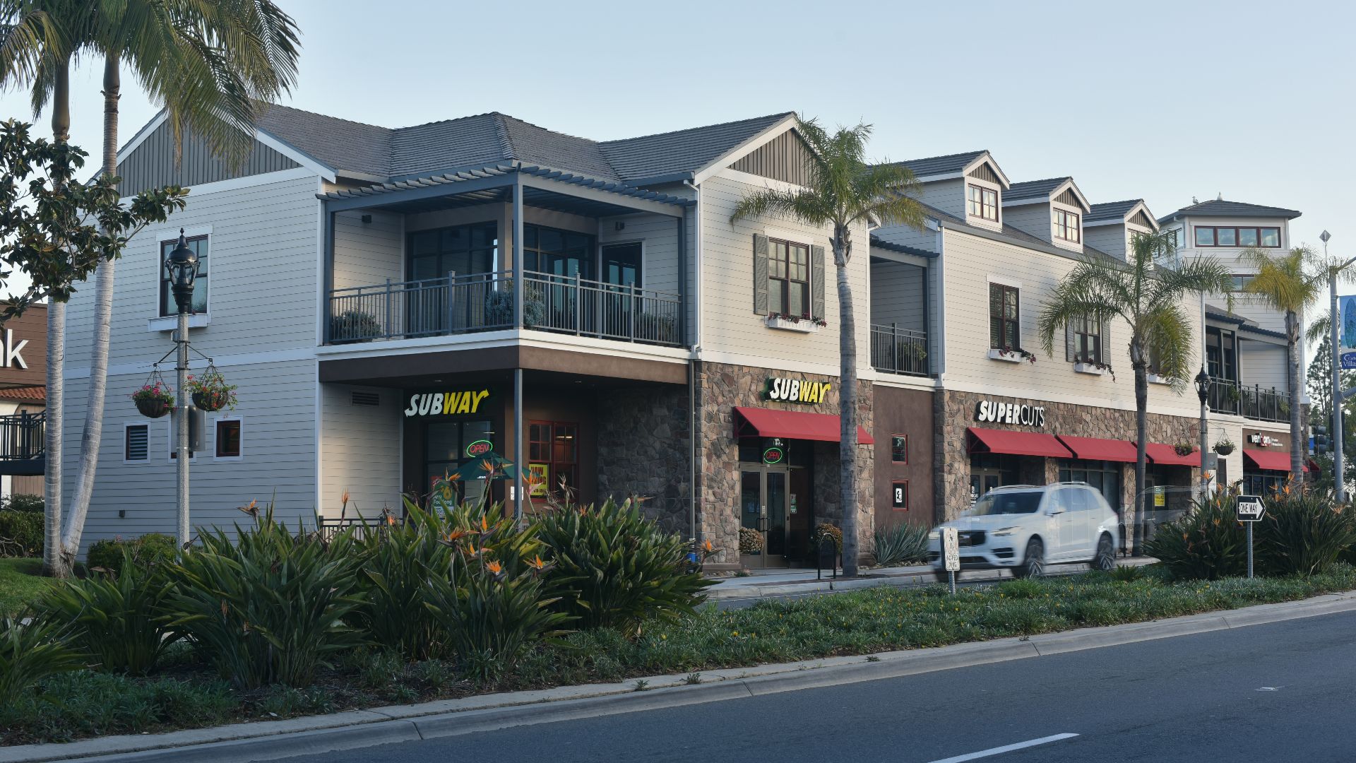 Several retailers occupy ground level stores in a two story building along Carlsbad Village Drive.

HXW_2047