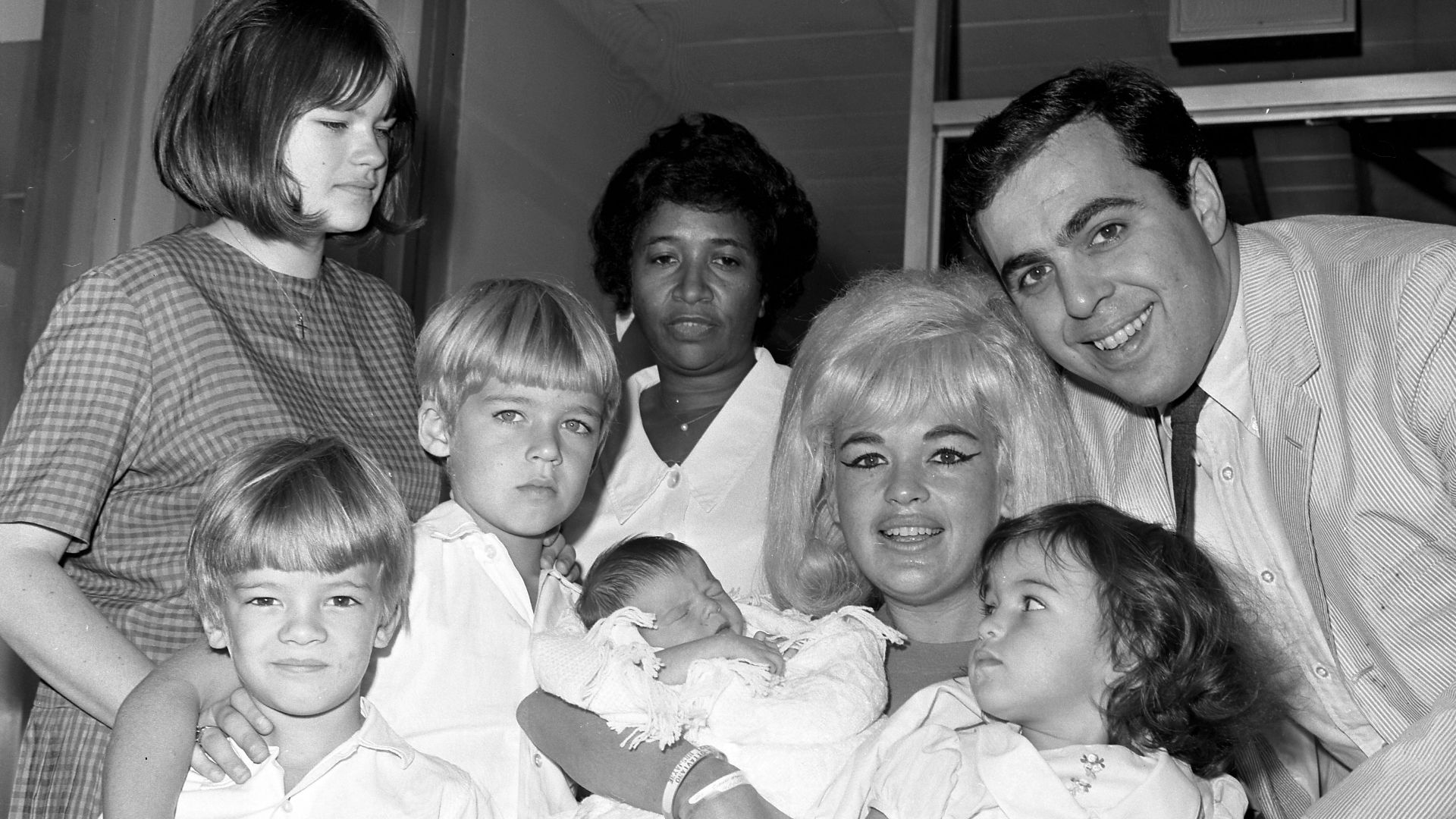 Jayne Mansfield cuddles new son, Antonio Rapheal Cimber Ottaviano as they leave Cedars of Lebanon Hospital. Jayne was accompanied by her husband, Matt, and her four other children.
