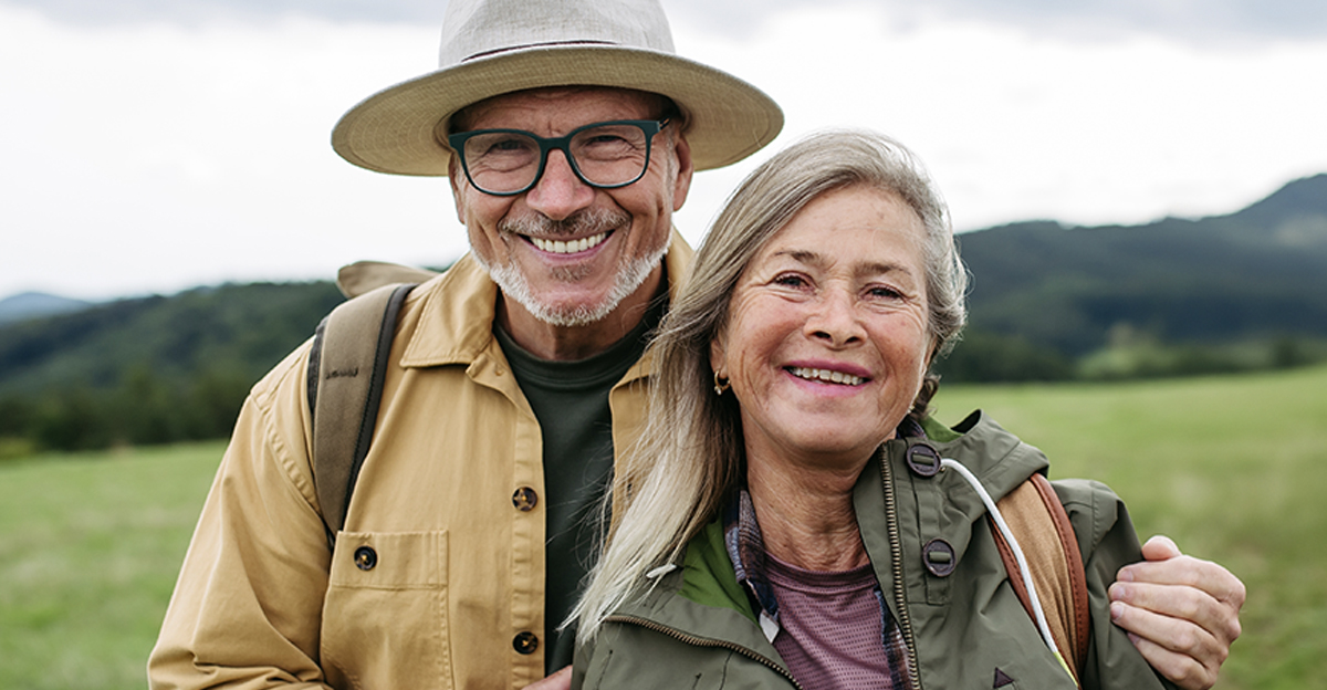 Older couple on group trip in autumn nature.
