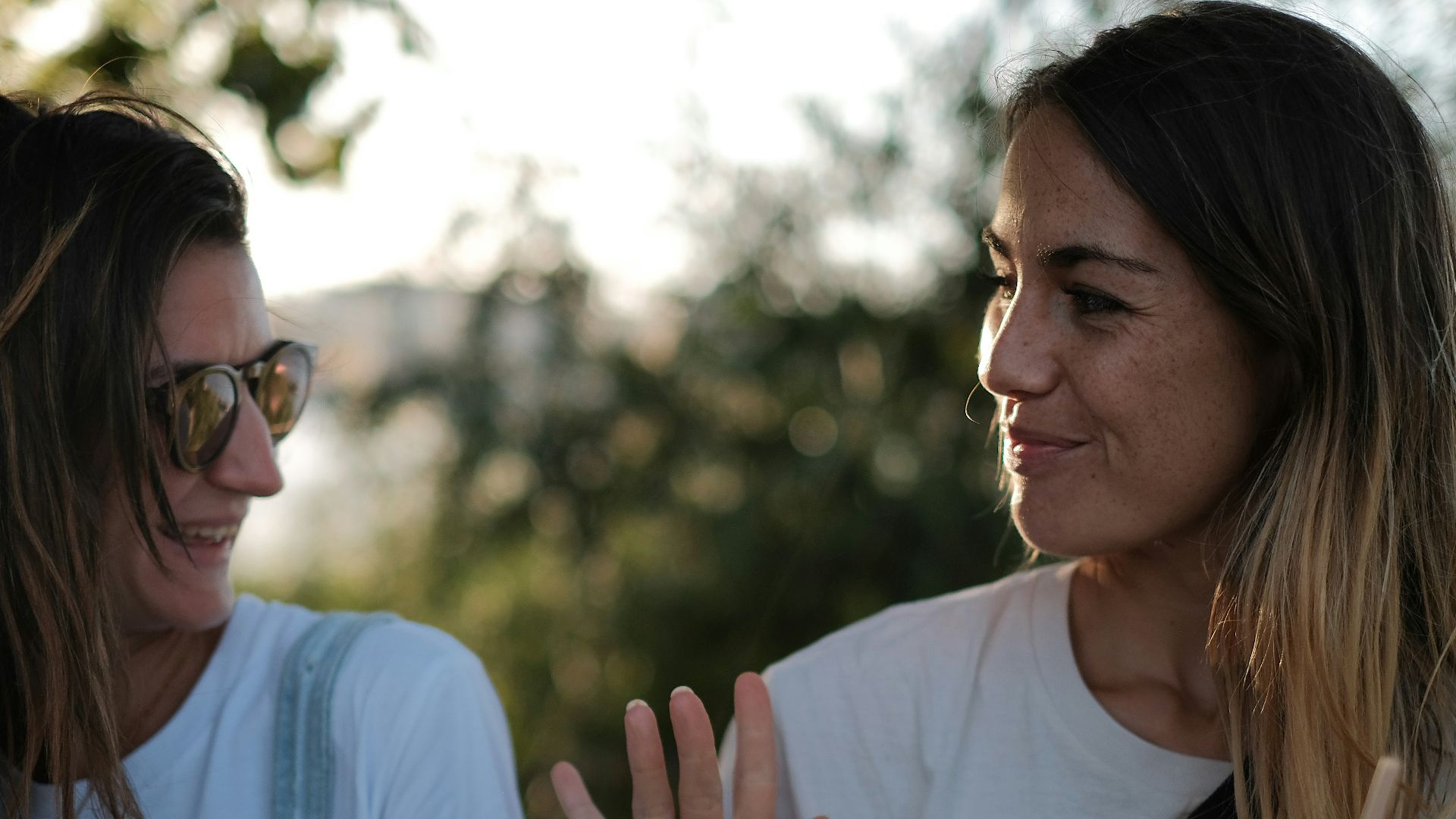 woman in white shirt smiling
