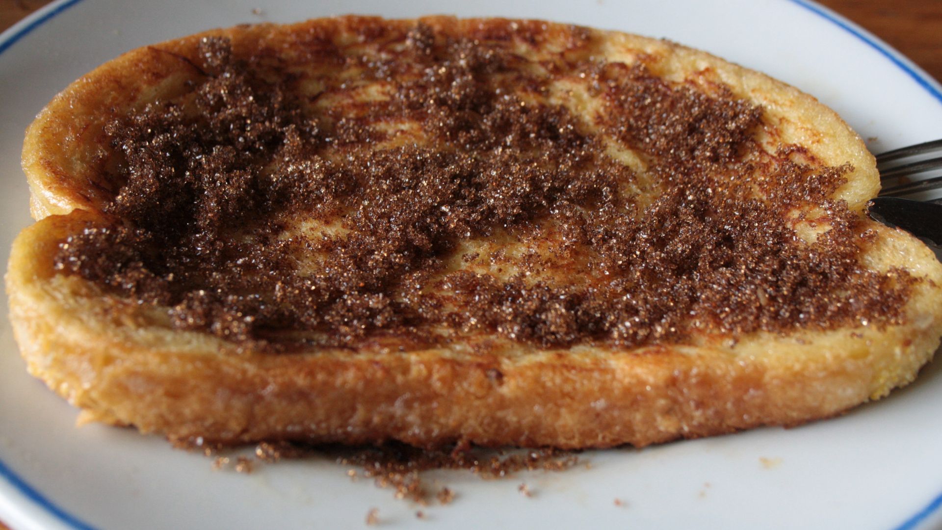 A 'wentelteefje' (Dutch for 'French toast') covered with Muscovado sugar. This particular one was made with a slice of cornbread.