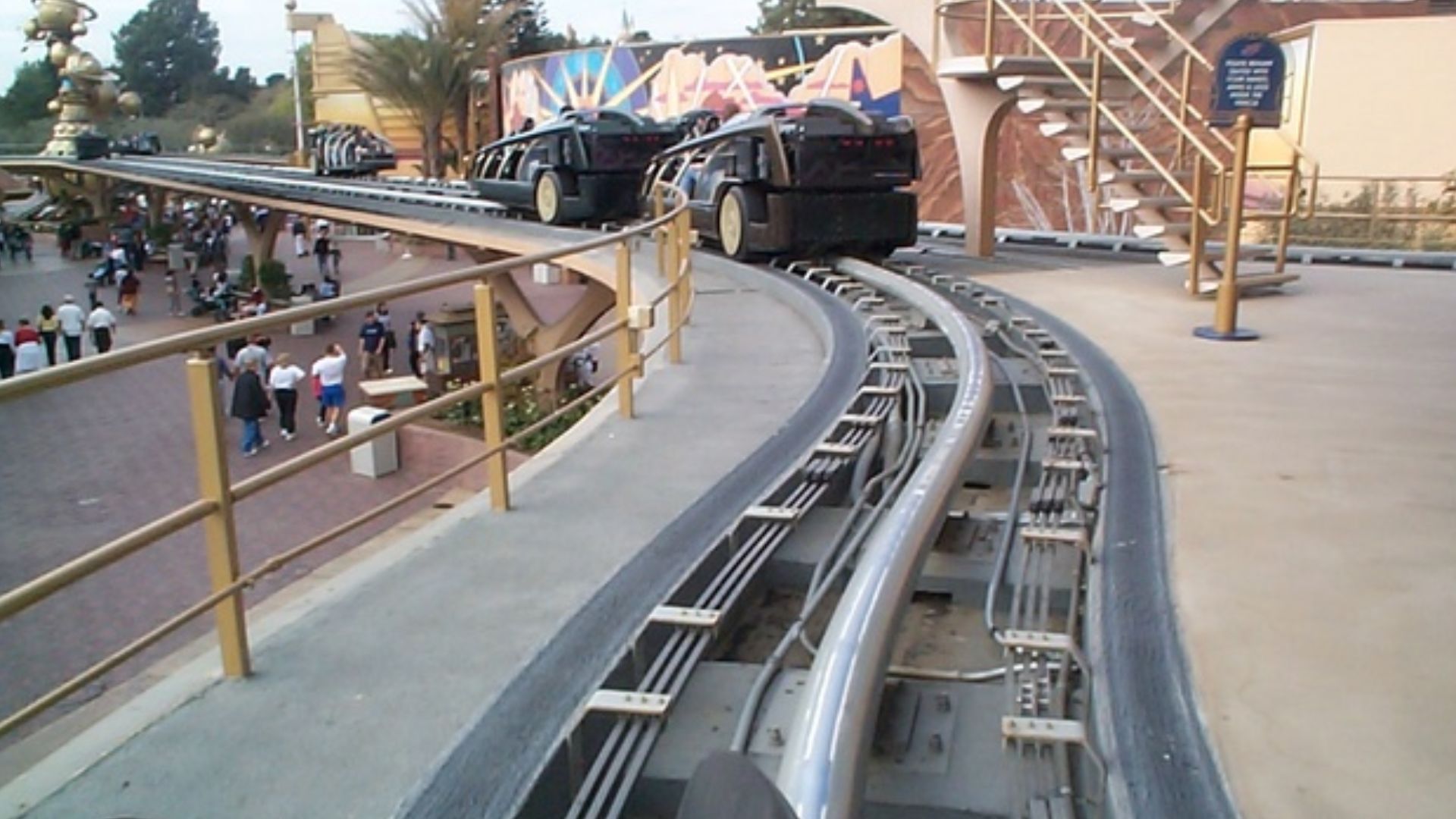 Rocket Rods leaving the loading platform. Cars paused before being flung down this track at high velocity and then slowing down to make the sharp corner toward the end. Disneyland, 2000.