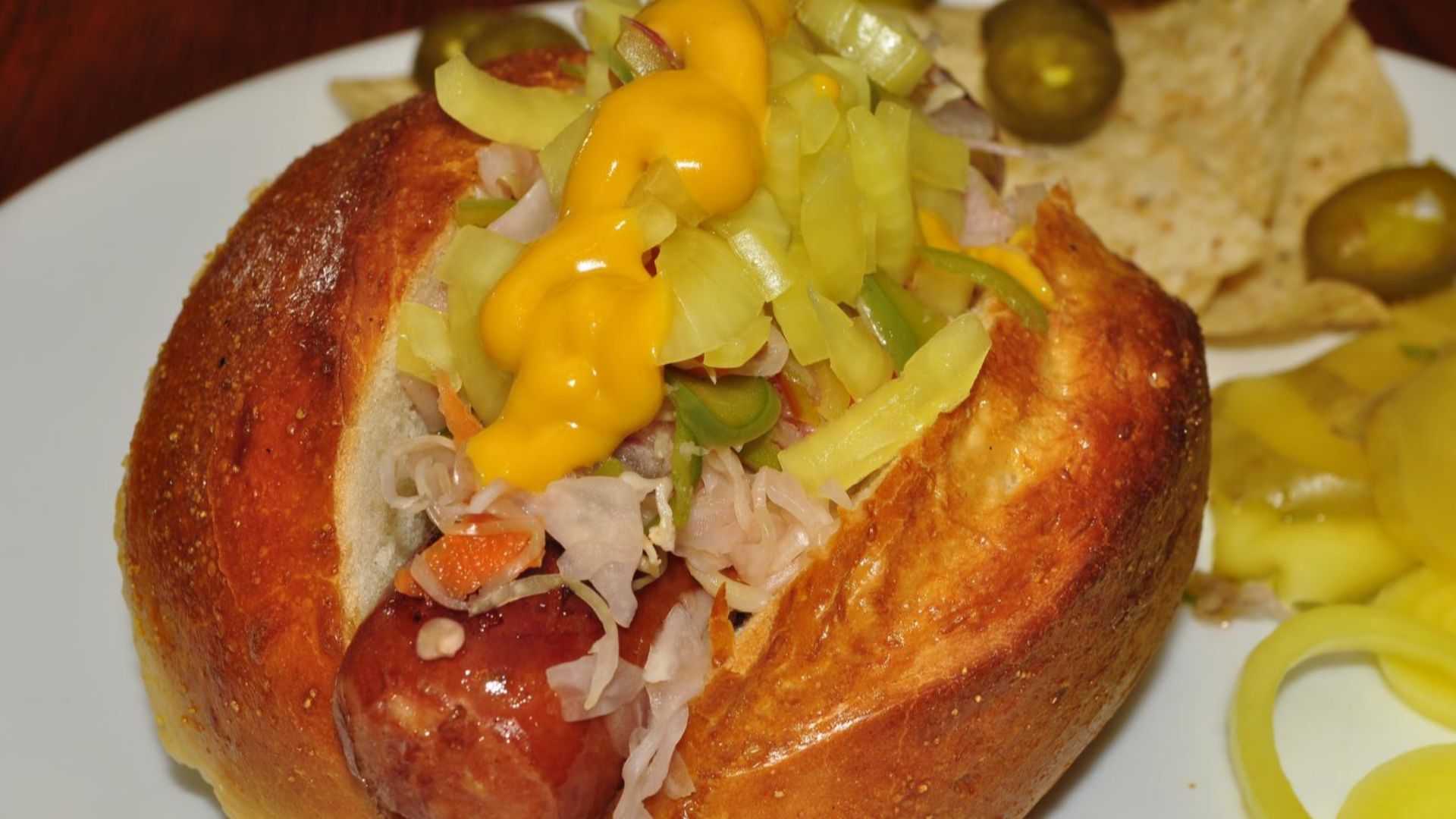 Sausage with slaw, pickled onion and honey mustard