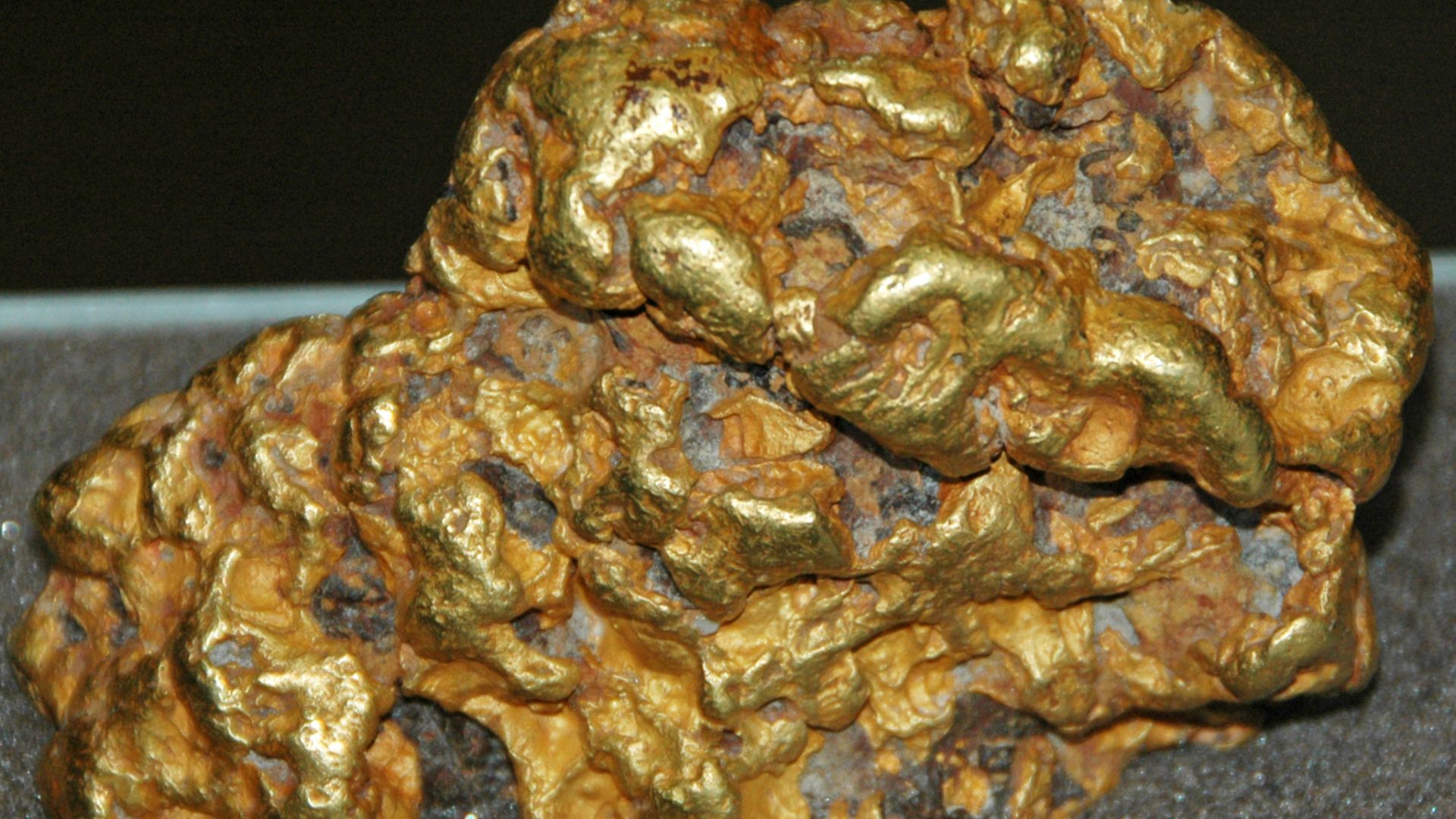 Gold nugget from Australia. (public display, Field Museum of Natural History, Chicago, Illinois, USA)

A mineral is a naturally-occurring, solid, inorganic, crystalline substrance having a fairly definite chemical composition and having fairly definite ph