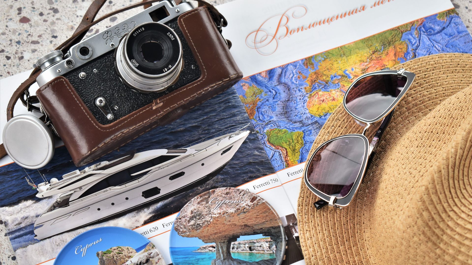 Explore travel with a vintage camera, map, and accessories perfect for a getaway.