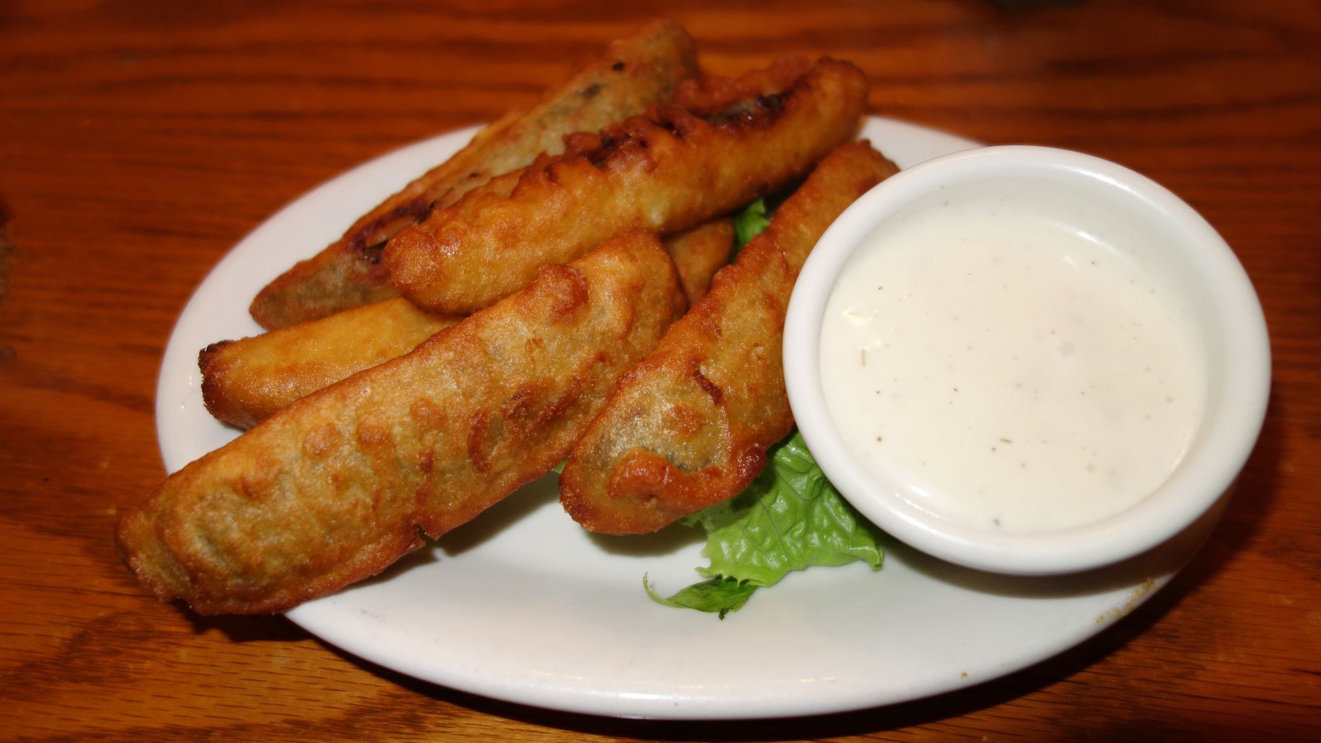 Fried pickles with sauce - Mecklenburg Gardens, Cincinnati, Ohio, USA.