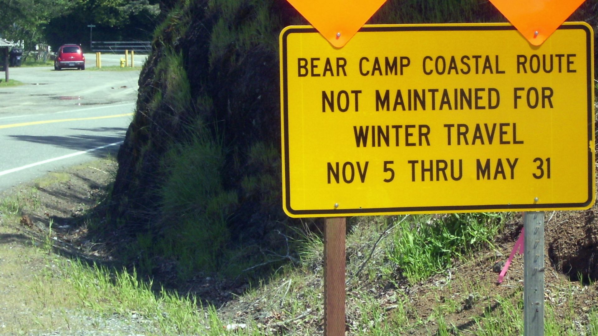 Warning sign for the west end of Bear Camp Road just outside Gold Beach Oregon where it is known as Jerrys Flat Road