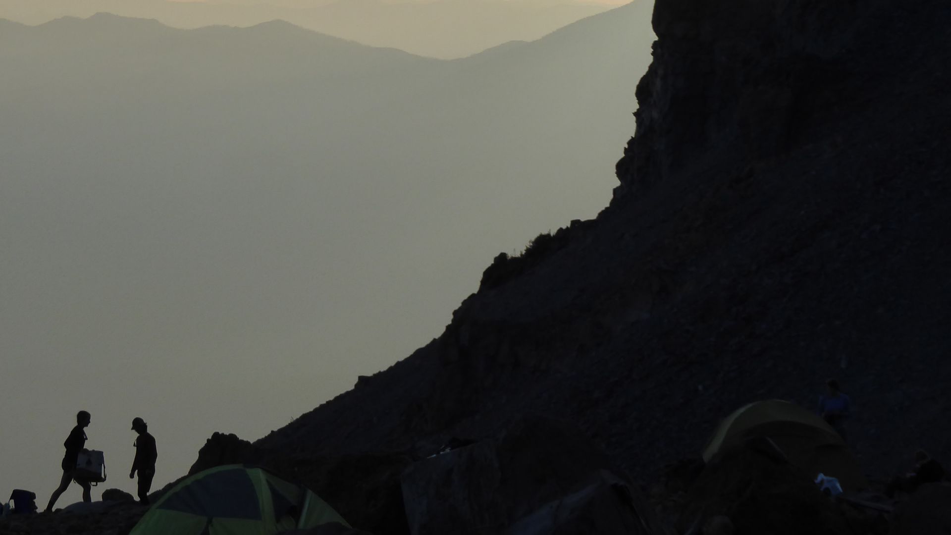 Helen Lake sits underneath the west face of Mount Shasta located in City of Mount Shasta, California. It is a campsite commonly used as a base camp for the forthcoming Summit attempt. This photo was taken during the Summer at bed time, or 7:30 p.m.-wake u