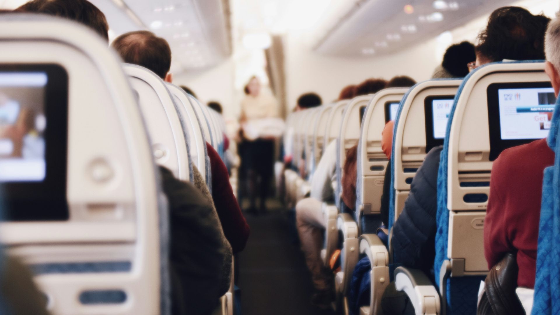 shallow focus photography of people inside of passenger plane