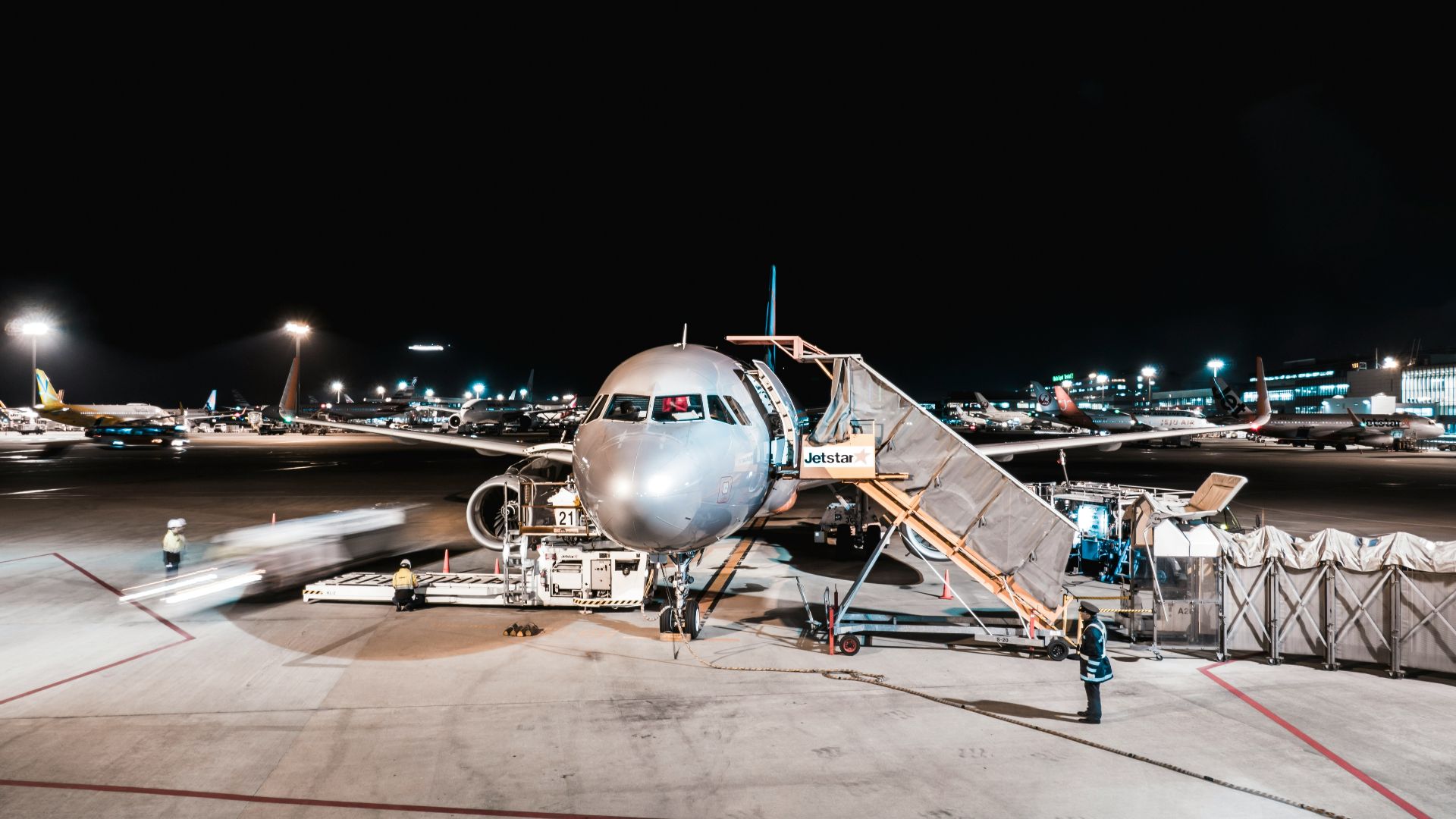 person standing near airliner