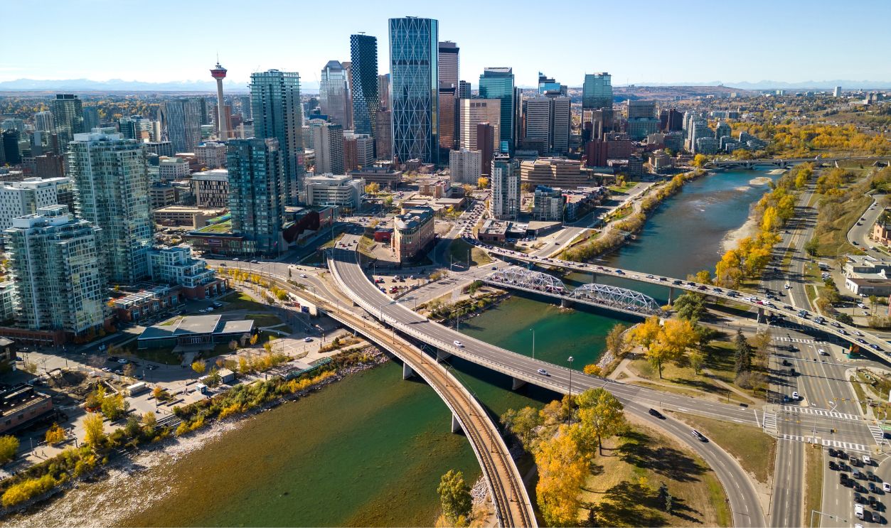 Downtown Calgary skyline and Bow River in autumn season. Aerial view of City of Calgary, Alberta, Canada.
