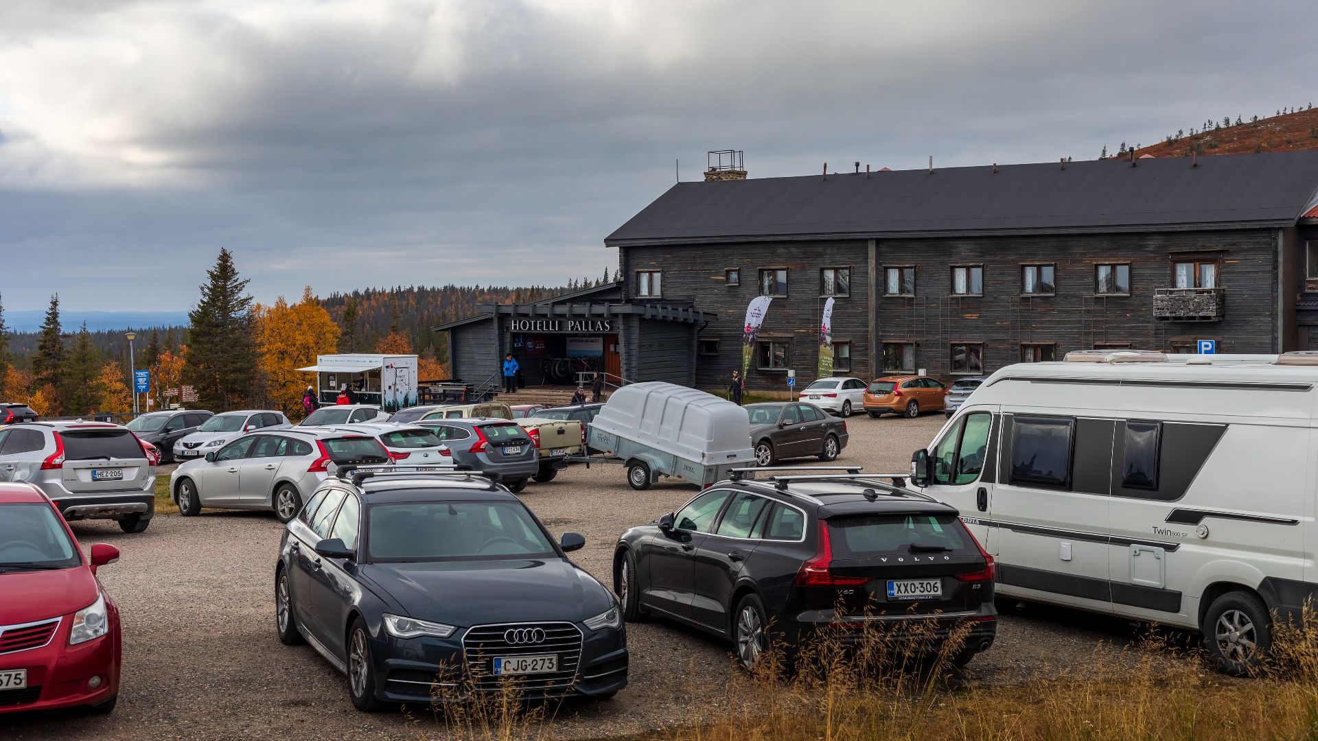 Car parking at Hotel Pallas during the autumn high season in Muonio municipality, Lapland, Finland in 2021 September.