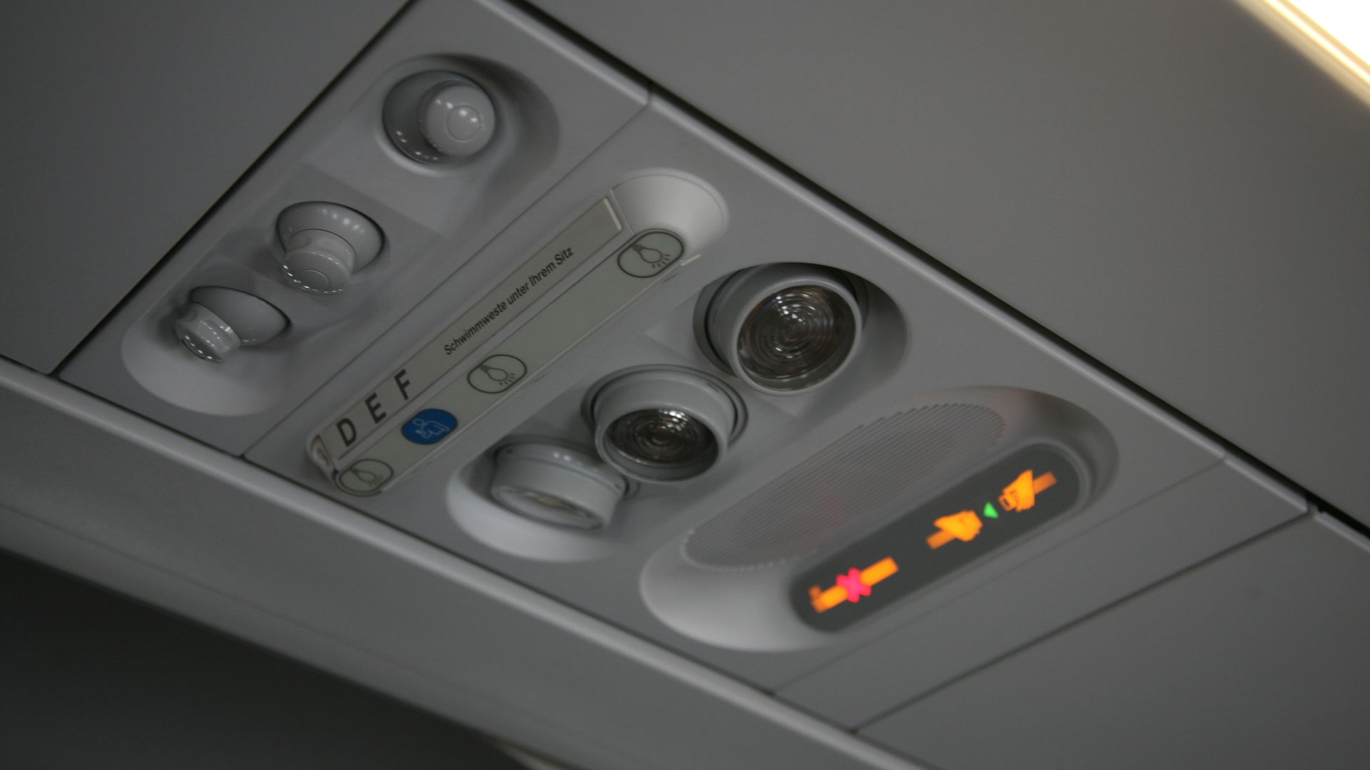 Ventilationnozzles, lightswitches, call button for the flight attendents, lights, and information signs, overhead in the passenger compartment of an airplane.