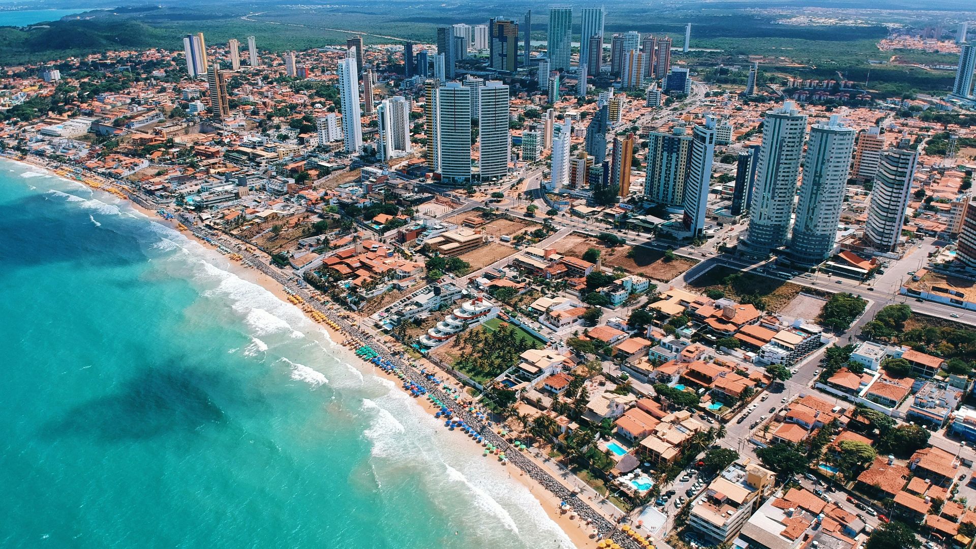 aerial photography of city building near the seashore during daytime