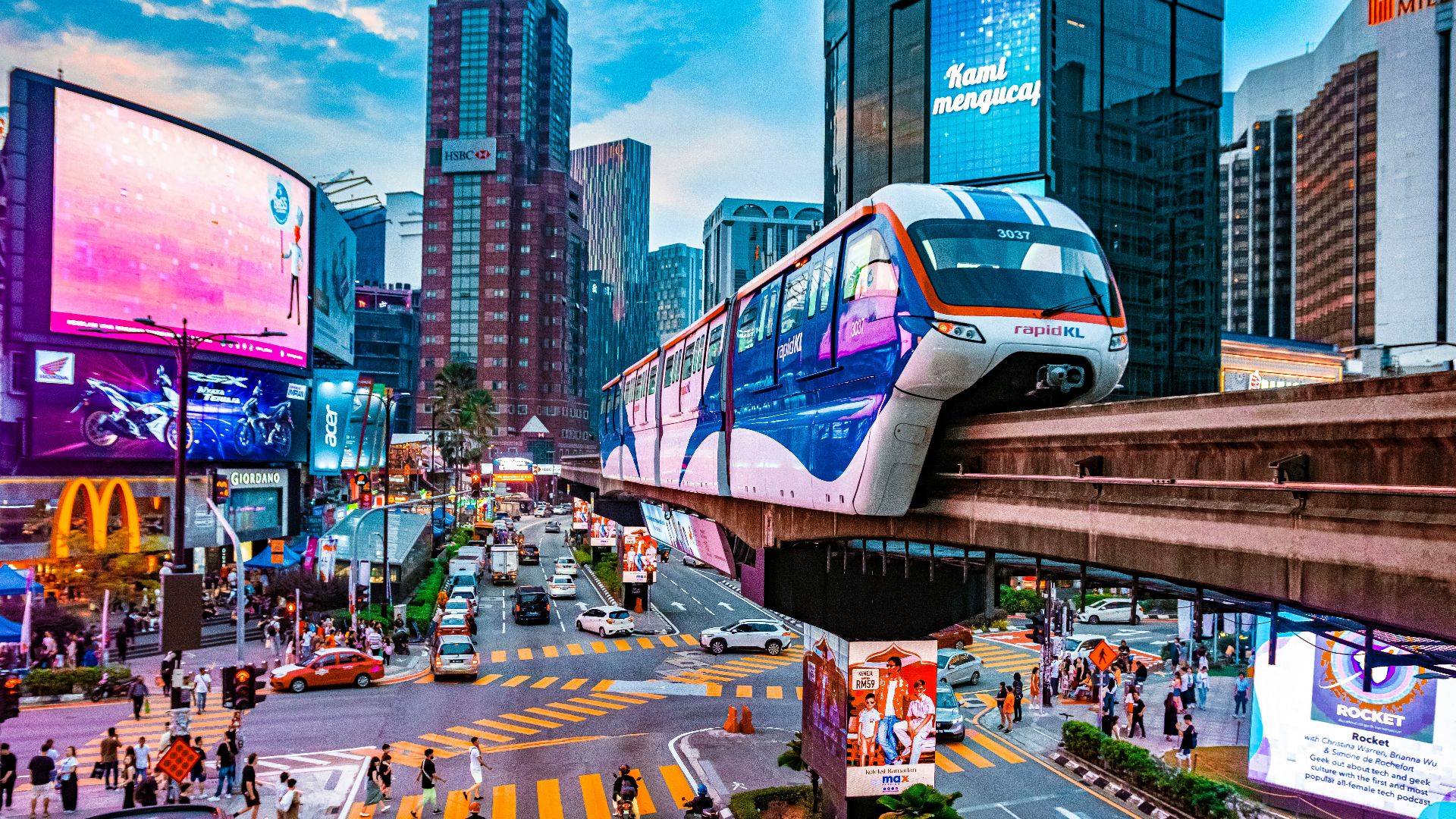 a city street filled with traffic and tall buildings