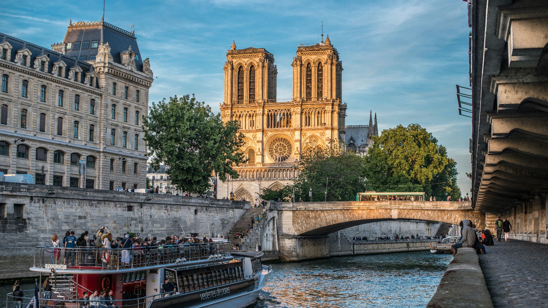 a boat on a river with buildings on either side of it