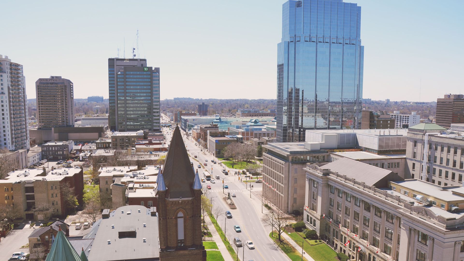 Scenic aerial cityscape of London, Ontario with modern architecture and busy streets.