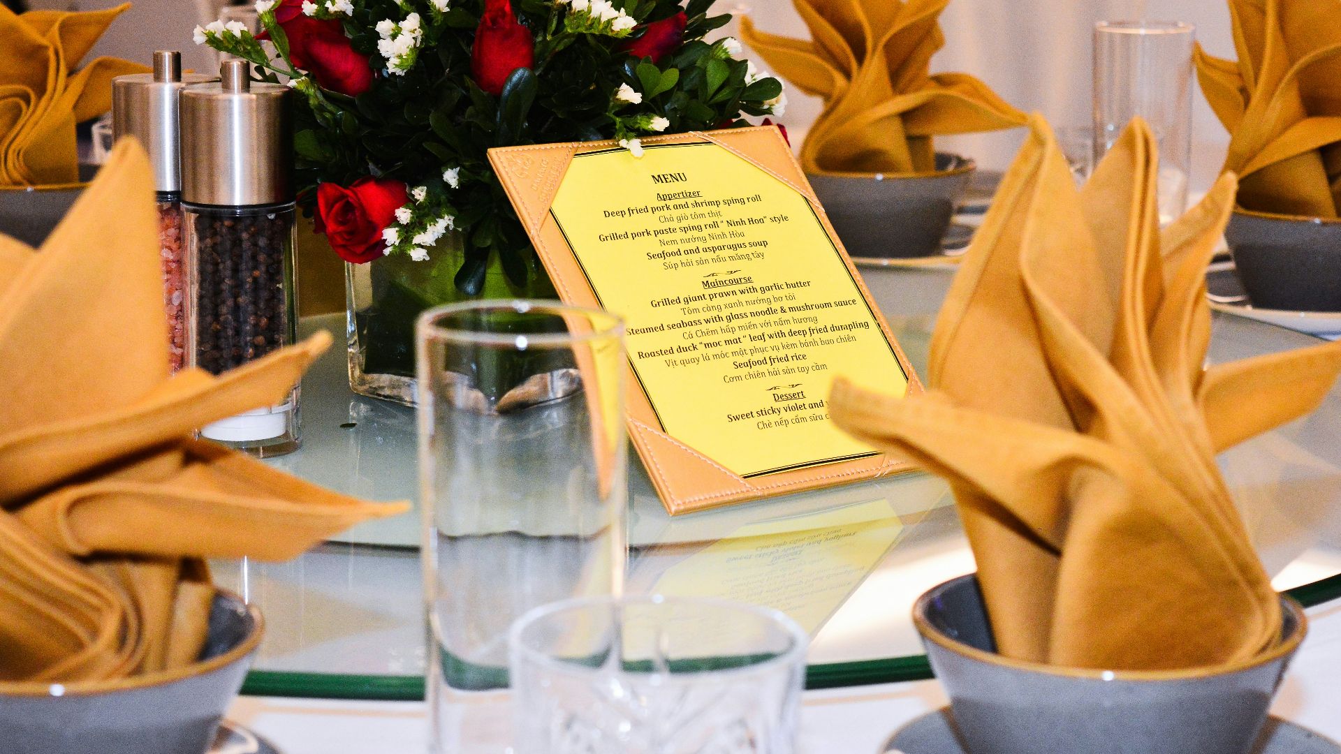 a table set with a menu and napkins