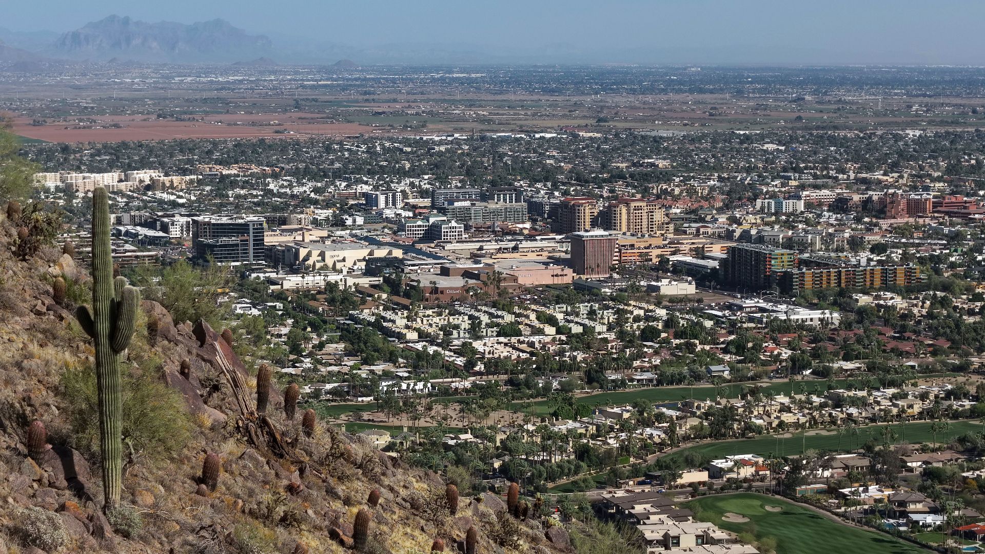 Aerial view of downtown Scottsdale, Arizona (pop. 241,361), viewed from Camelback Mountain in 2026.