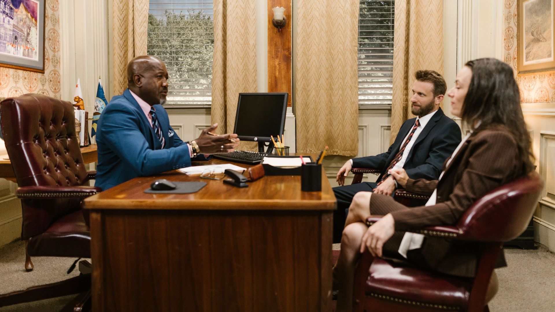 Lawyers discussing with a client in a professional office environment. Business meeting concept.