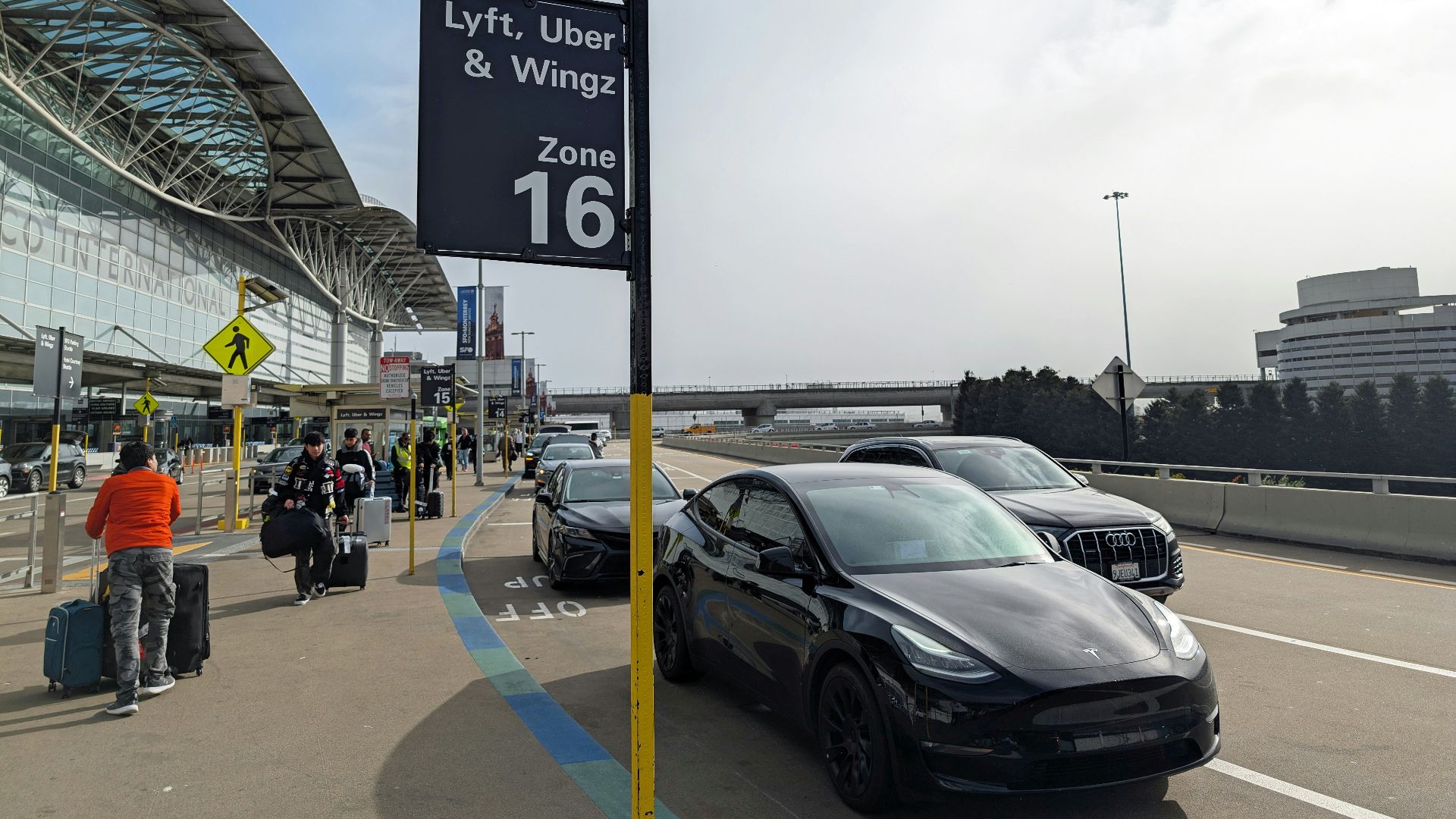 A car parked in front of an airport