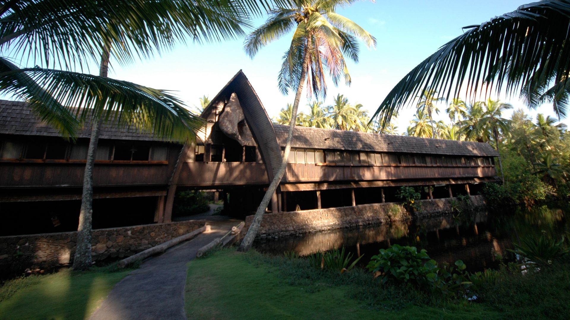 Exterior of the backside of the Lagoon Terrace Lounge and Heritage Room buildings at the Coco Palms Resort on the island of Kauai.  The hotel was destroyed by hurricane Iniki in September 1992.