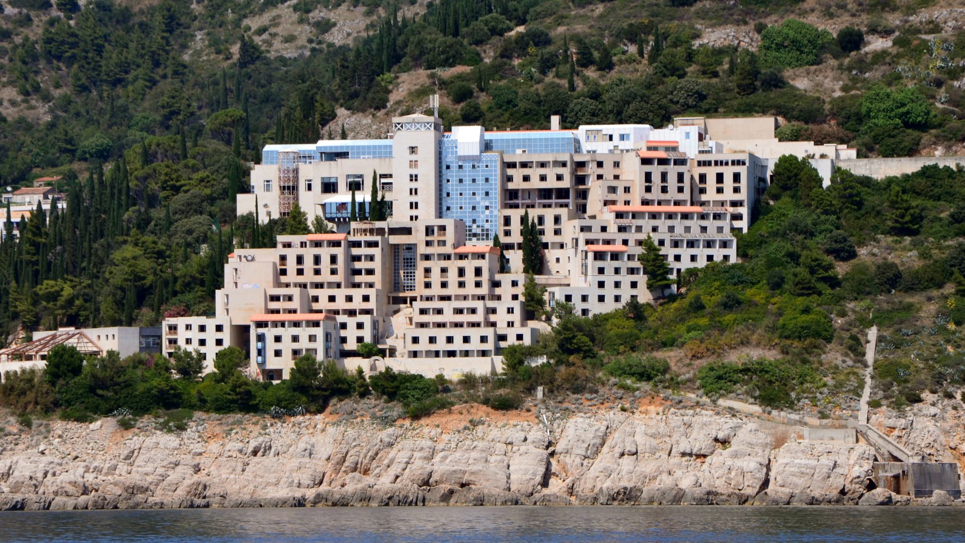 The Hotel Belvedere of Dubrovnik (Croatia), abandoned, photographed from the sea in July 2015.