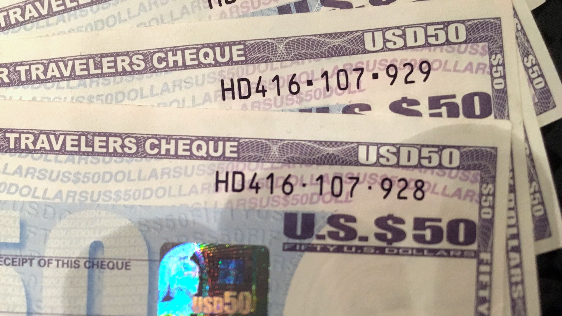 Four Travelers Cheques of 50 USD each, issued by American Express, bought ca. 2012, have long been spent. Soon after the photo was taken in 2016, they were changed back to cash.