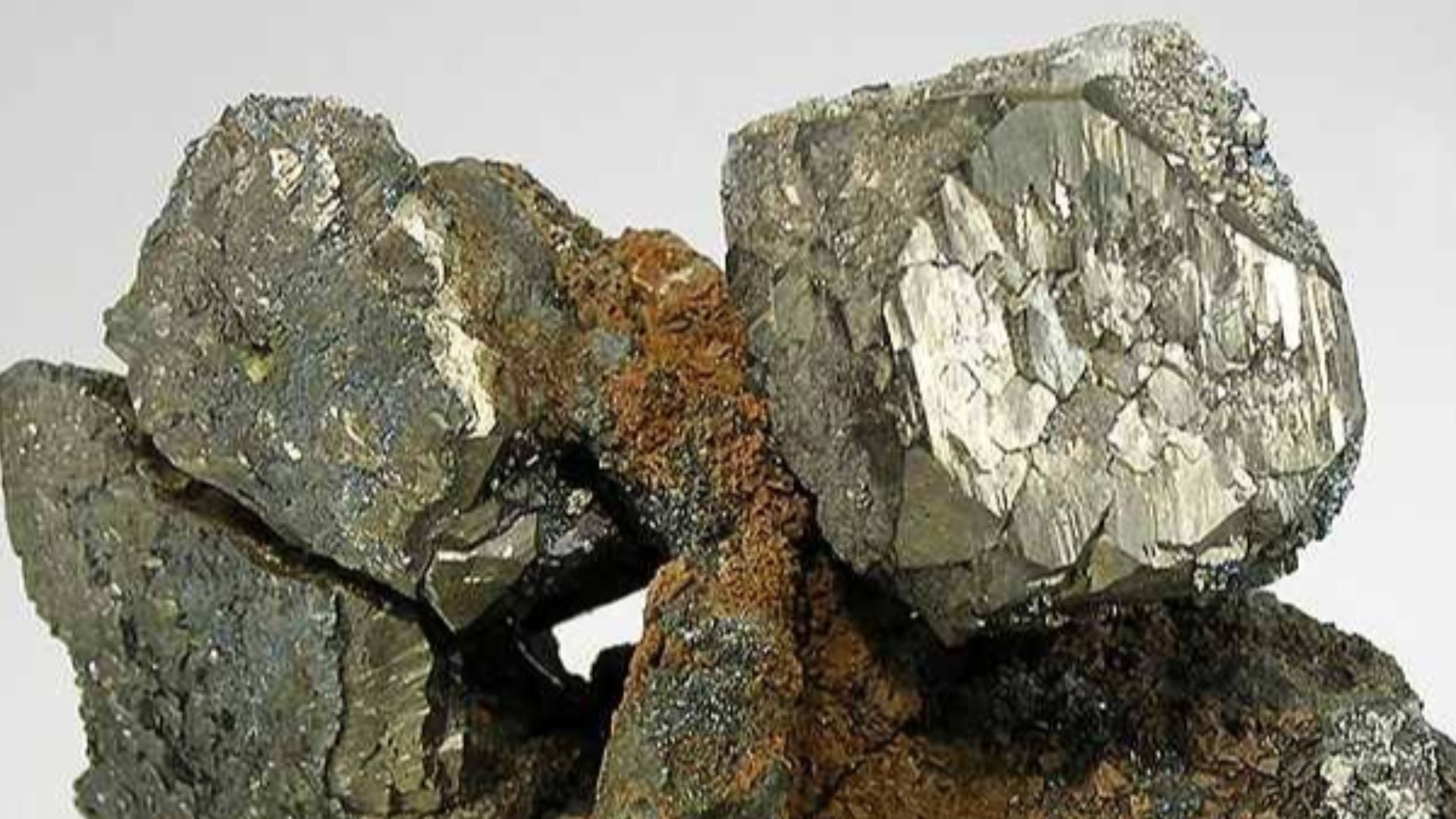 Pyrite
Locality: Rensselaer Quarry (Rensselaer Stone Company Quarry; Pleasant Ridge Quarry), Pleasant Ridge, Jasper County, Indiana, USA (Locality at mindat.org)
Size: 8.9 x 6.9 x 4.0 cm.
Here are two highly-modified crystals of pyrite - one of them with 