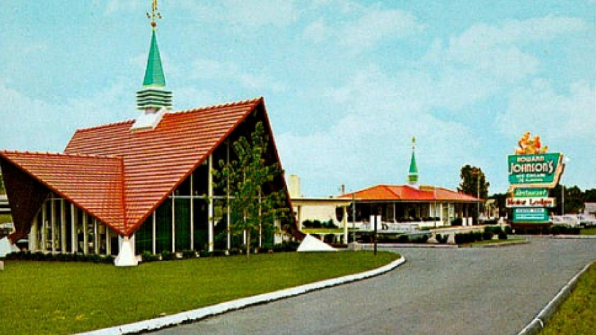 Nice colorful and collectible vintage scenic view of historic Howard Johnson's, featuring an iconic Howard Johnson's Restaurant and Motor Lodge along an American highway.
