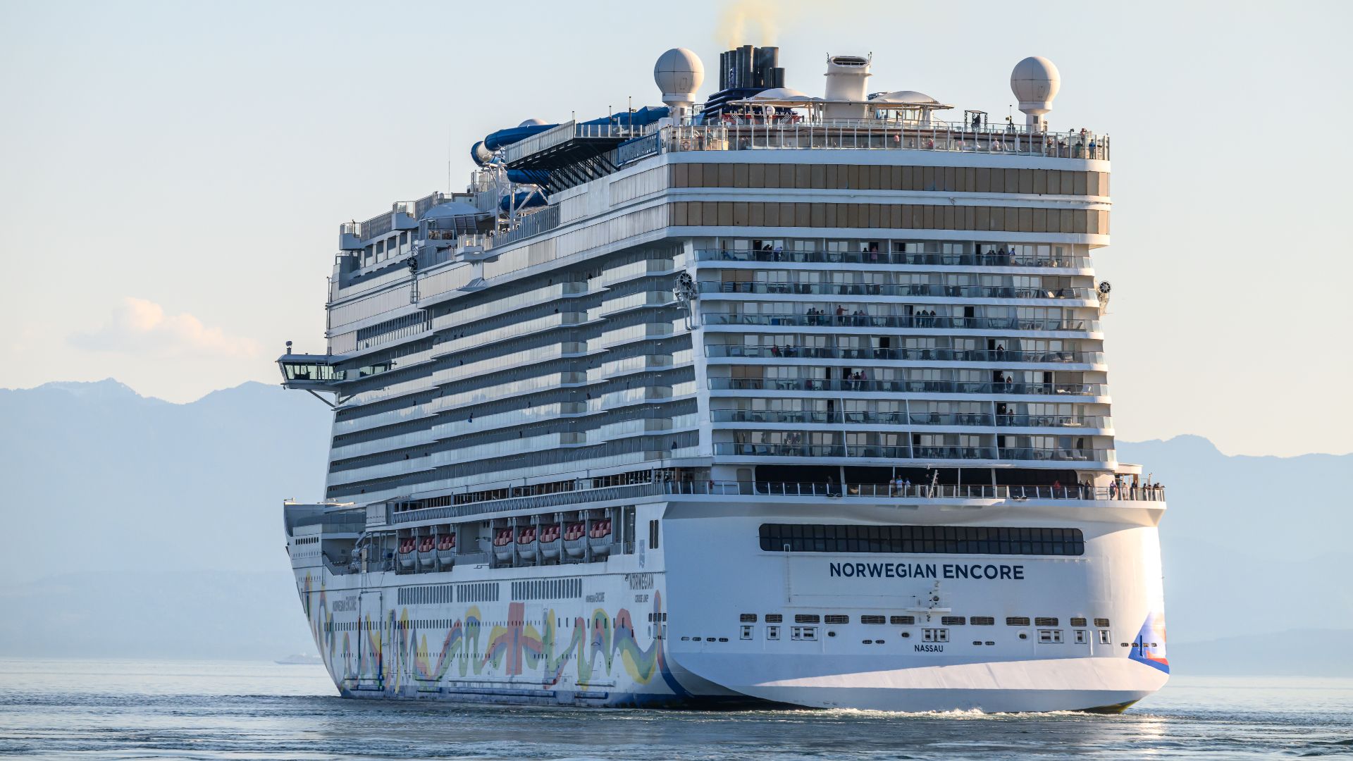 Norwegian Cruise Lines ship, NORWEGIAN ENCORE - IMO 9751511, MMSI 311000879; leaving Victoria BC Canada at sunset on May 2, 2026.