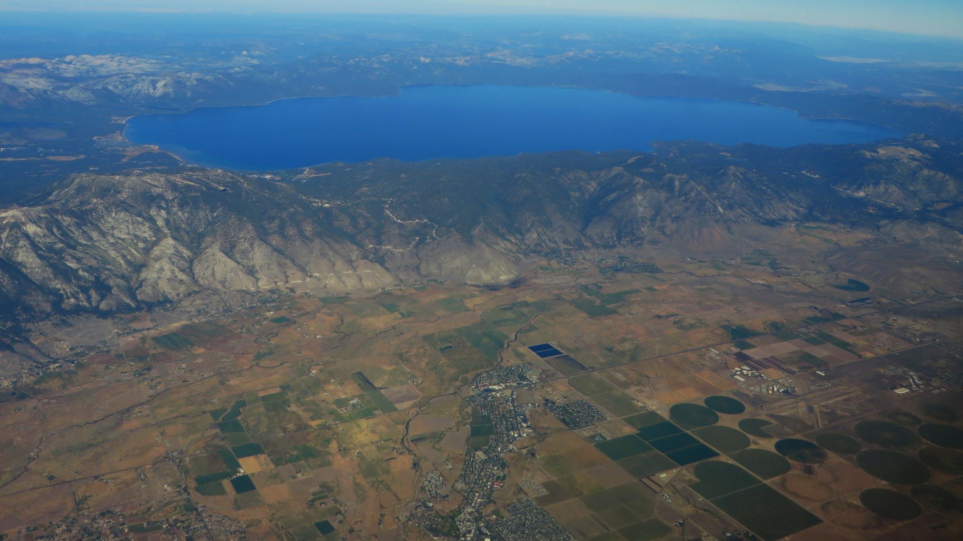 Lake Tahoe is a large freshwater lake in the Sierra Nevada of the United States. At a surface elevation of 6,225 ft (1,897 m), it is located along the border between California and Nevada, west of Carson City. Lake Tahoe is the largest alpine lake in Nort