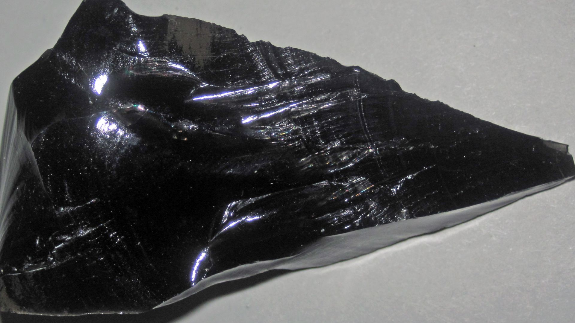 (~6.4 centimeters across at its widest)

Igneous rocks form by the cooling & crystallization of hot, molten rock (magma & lava).  If this happens at or near the land surface, or on the seafloor, they are extrusive igneous rocks.  If this happens deep unde