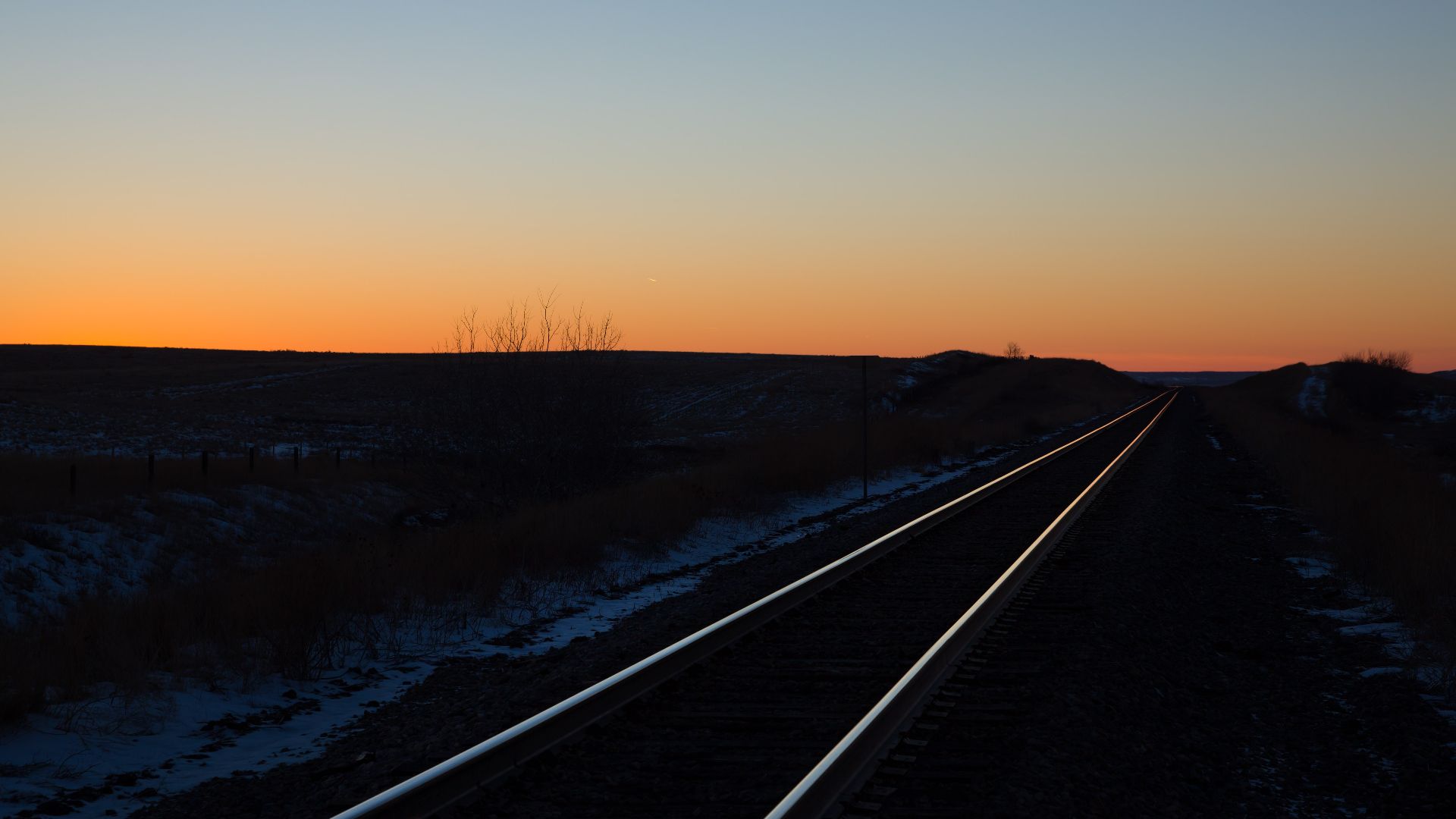 The Canadian Pacific Railway line near Tompkins, Saskatchewan, Canada at dusk.