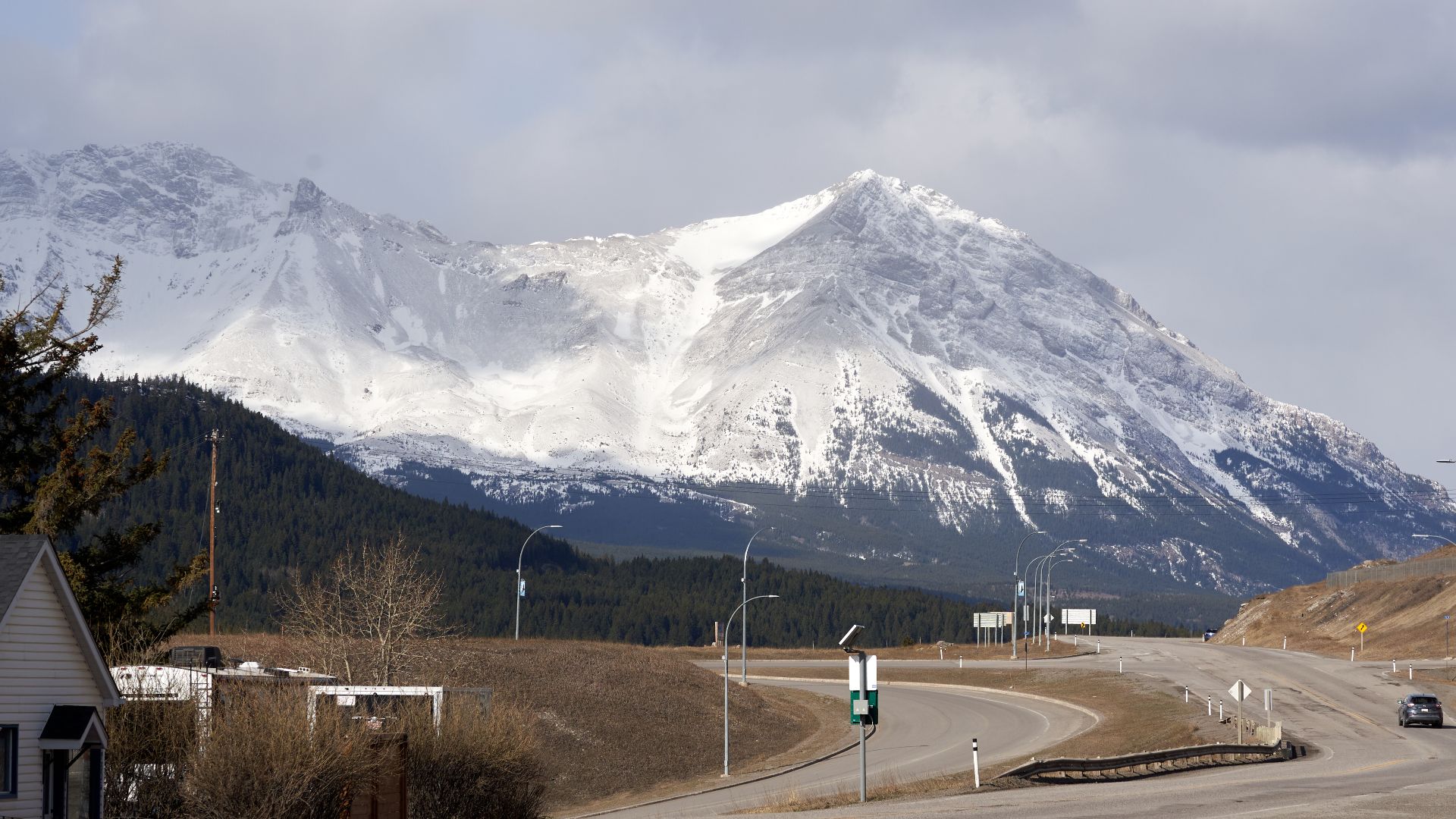 While driving through Crowsnest Pass, one can look back towards BC and the surrounding mountain range