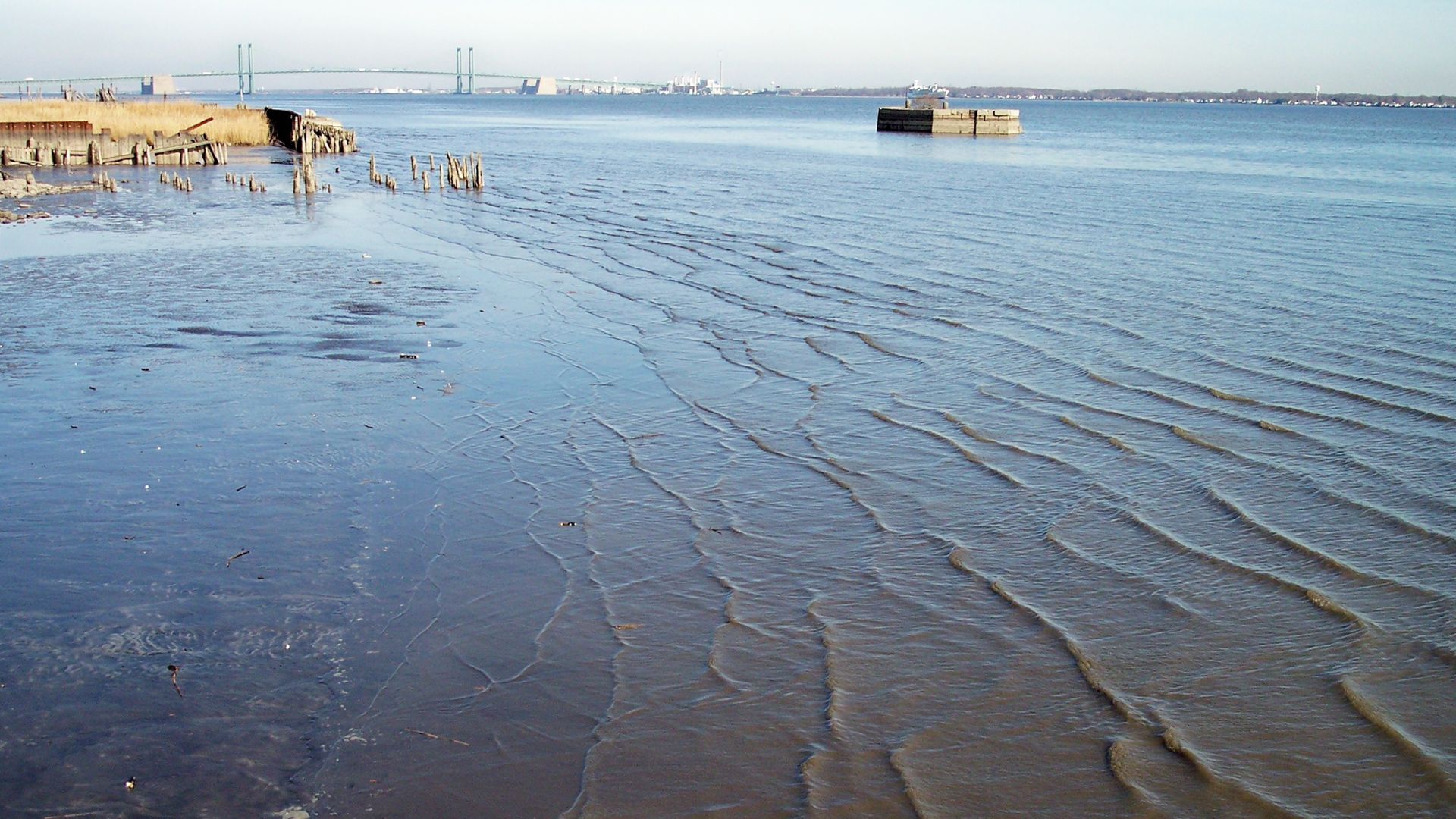 The lower w:Delaware River as viewed from w:New Castle, Delaware.  The w:Delaware Memorial Bridge is visible in the distance.