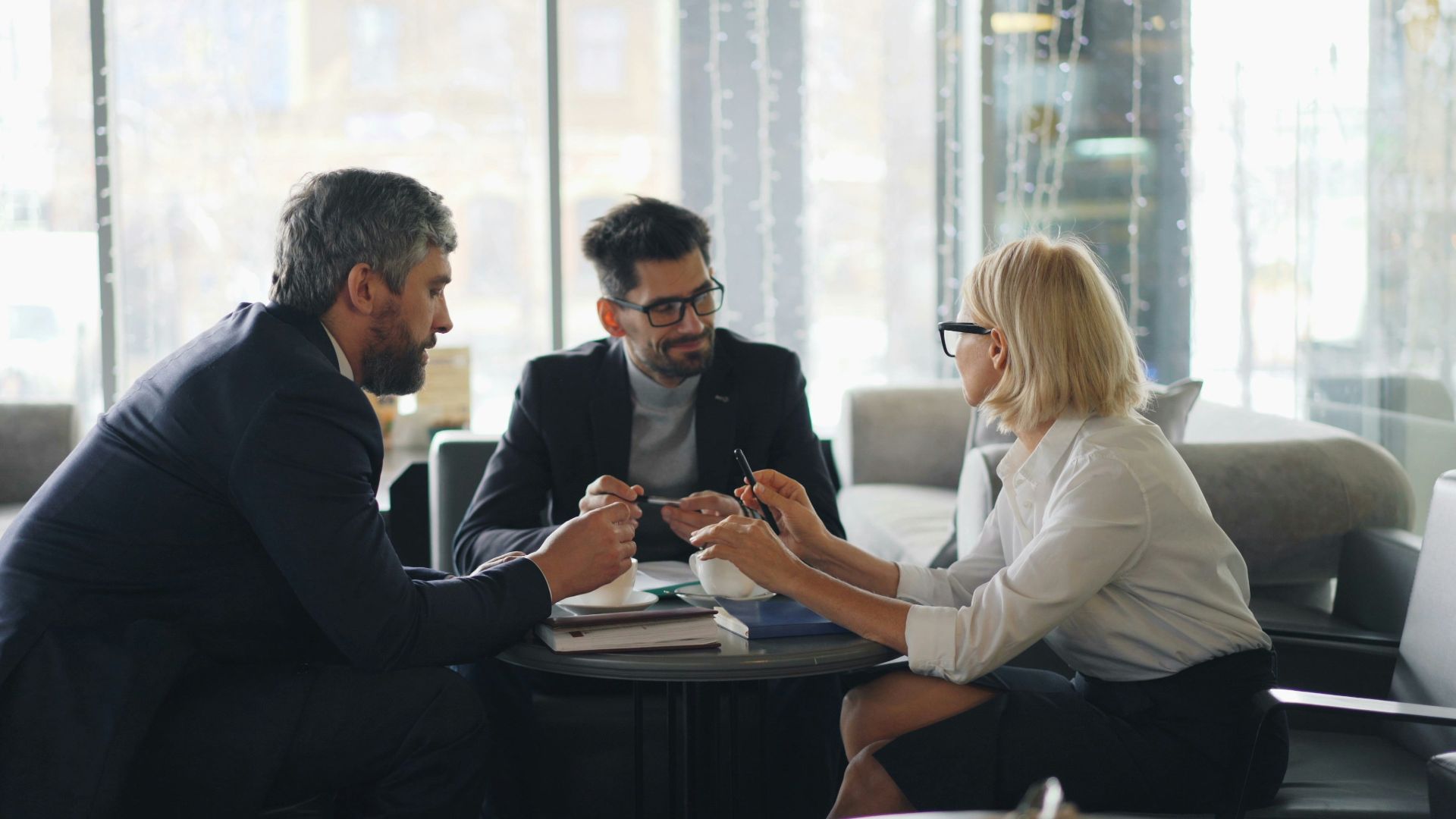 a group of people sitting around a table