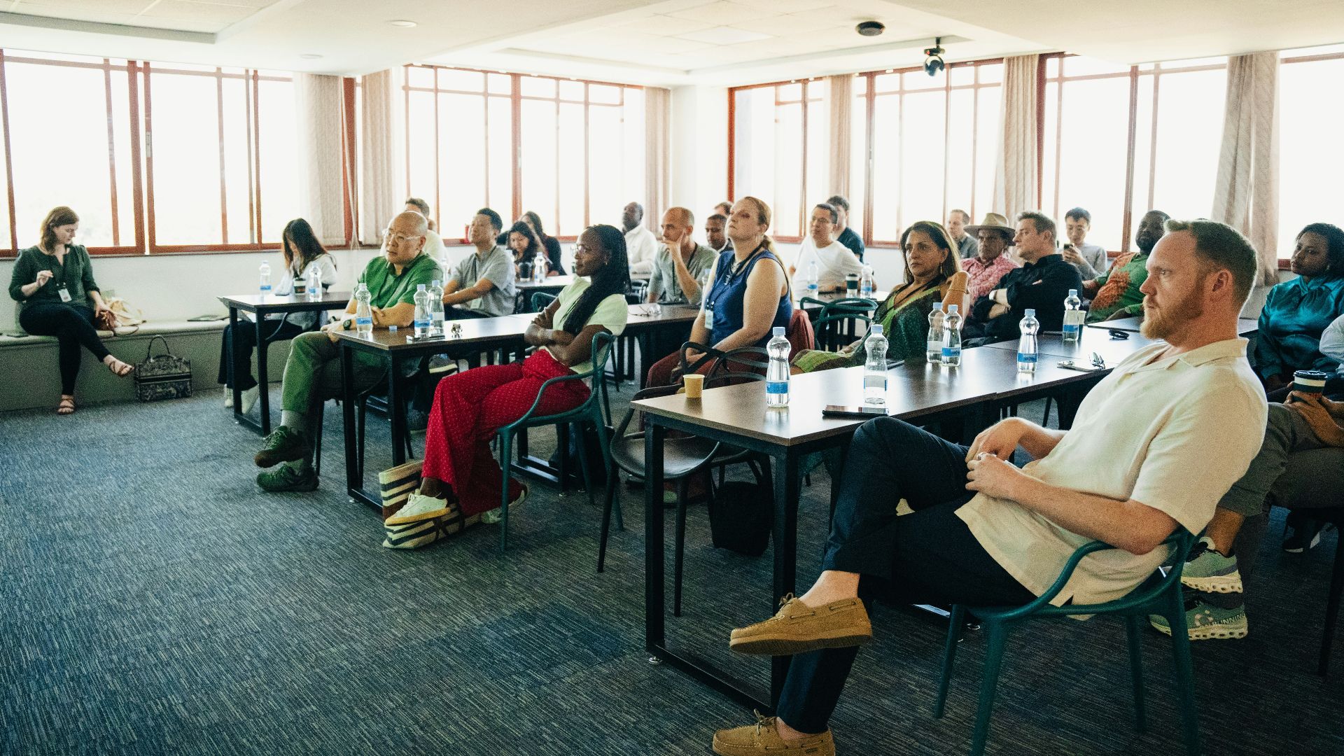 Audience attentively listening during a presentation in-person conference presentation