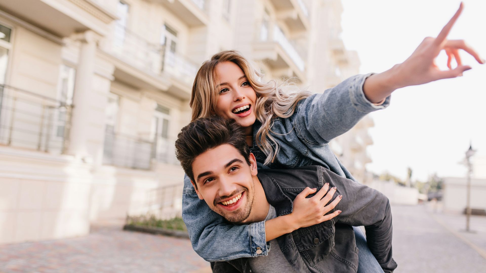 A man carrying a woman on his back