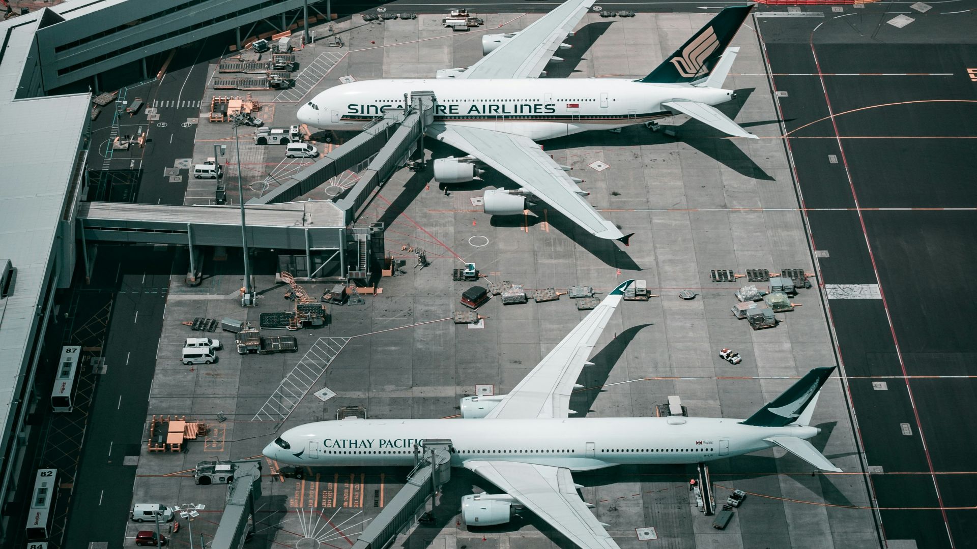 white and gray airplane on airport during daytime