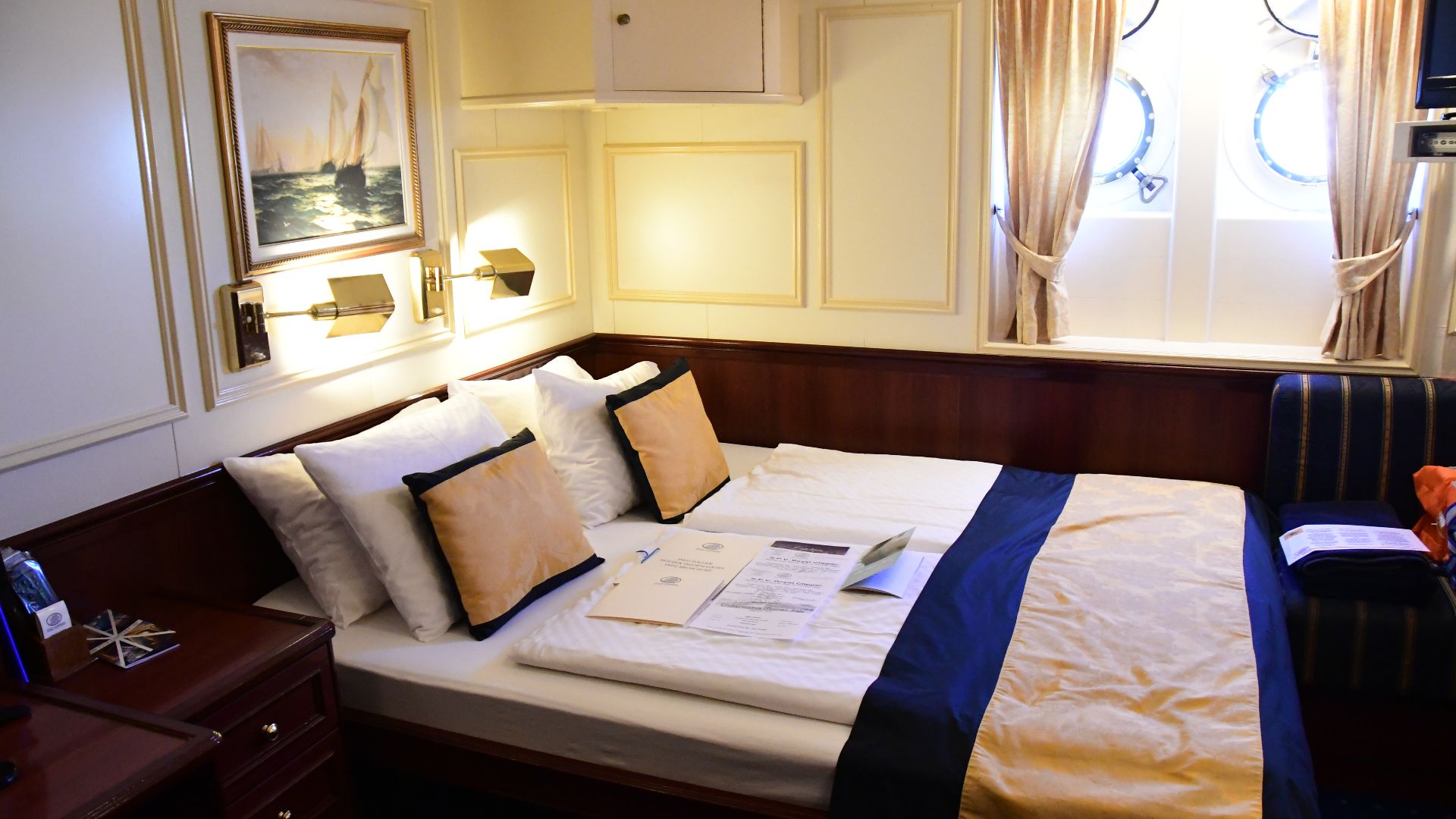 Interior views of cabin 221 on the Clipper Deck of the Royal Clipper, the largest sailing ship in the world in 2018.  This stateroom is considered a category 2.  No veranda, just portholes for a view, typical of most cabins on this ship.