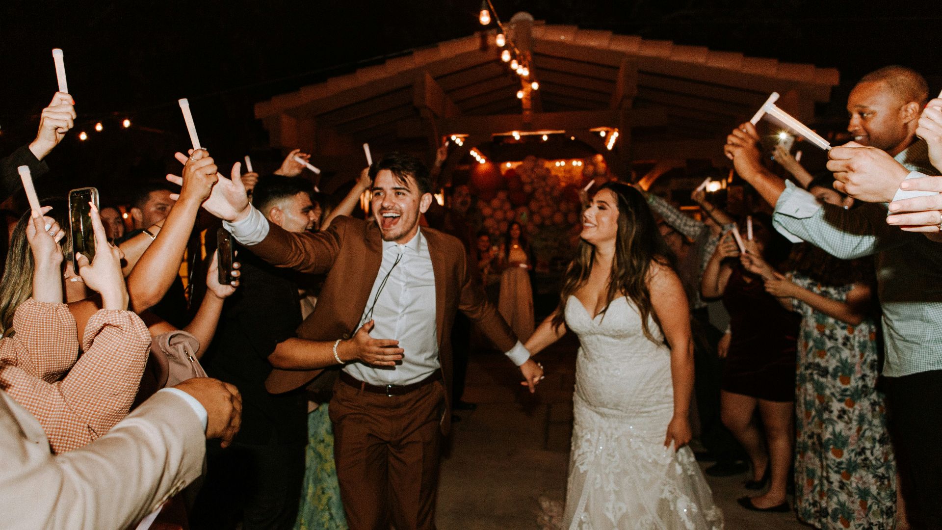 woman in white sleeveless dress standing beside man in white polo shirt