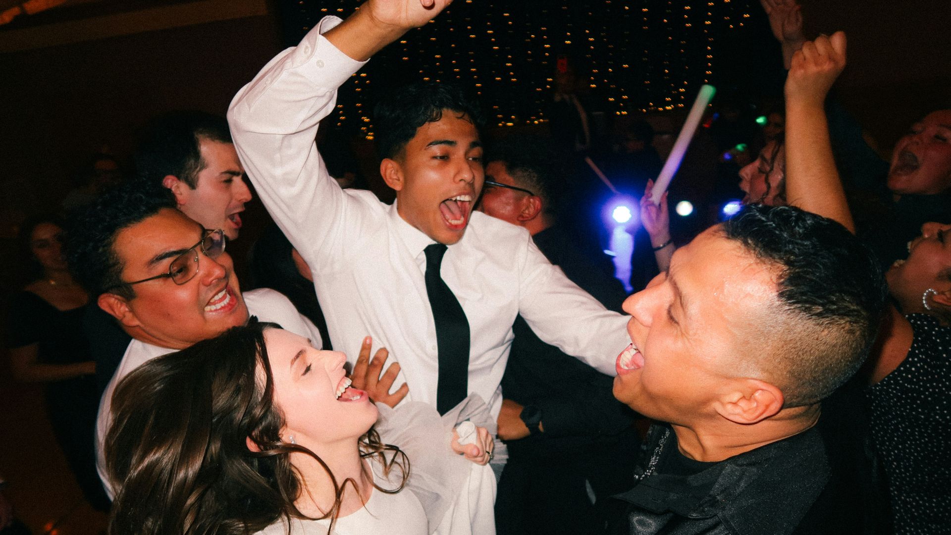 a group of people dancing at a party