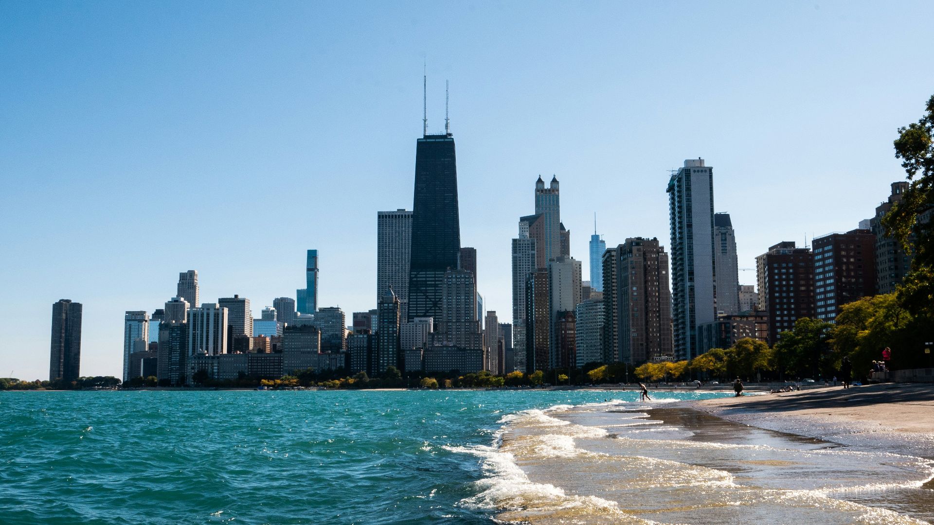 city skyline across body of water during daytime
