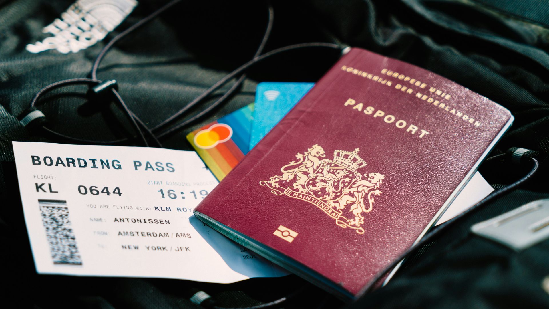 a passport and a boarding pass are on a bag