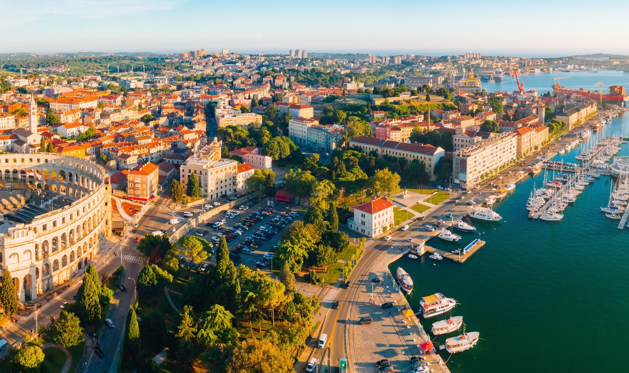Aerial drone photo of famous european city of Pula and arena of roman time. Location Istria county, Croatia, Europe. Popular touristic place. UNESCO world heritage site. Discover the beauty of earth.