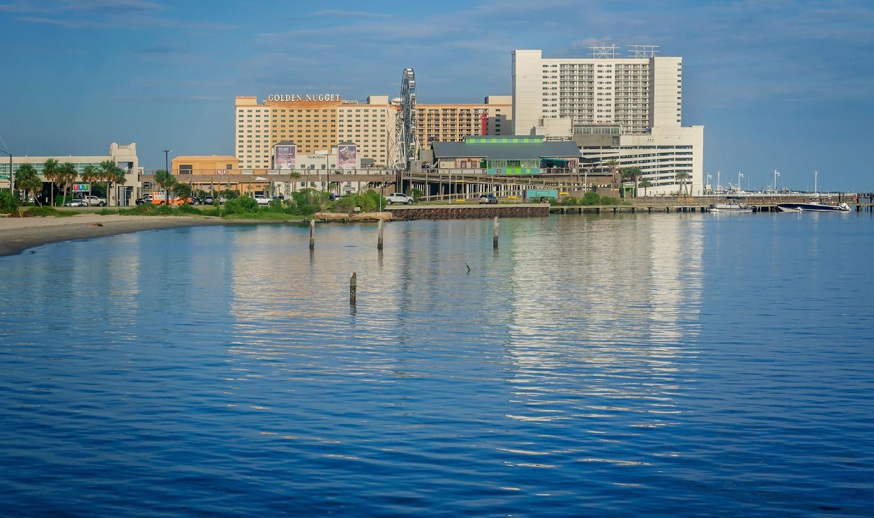 Biloxi, Mississippi, USA - Sept. 1, 2024: The Biloxi skyline is pictured from Biloxi Beach. Biloxi is a popular vacation destination due to its sandy beaches and numerous waterfront gambling casinos.