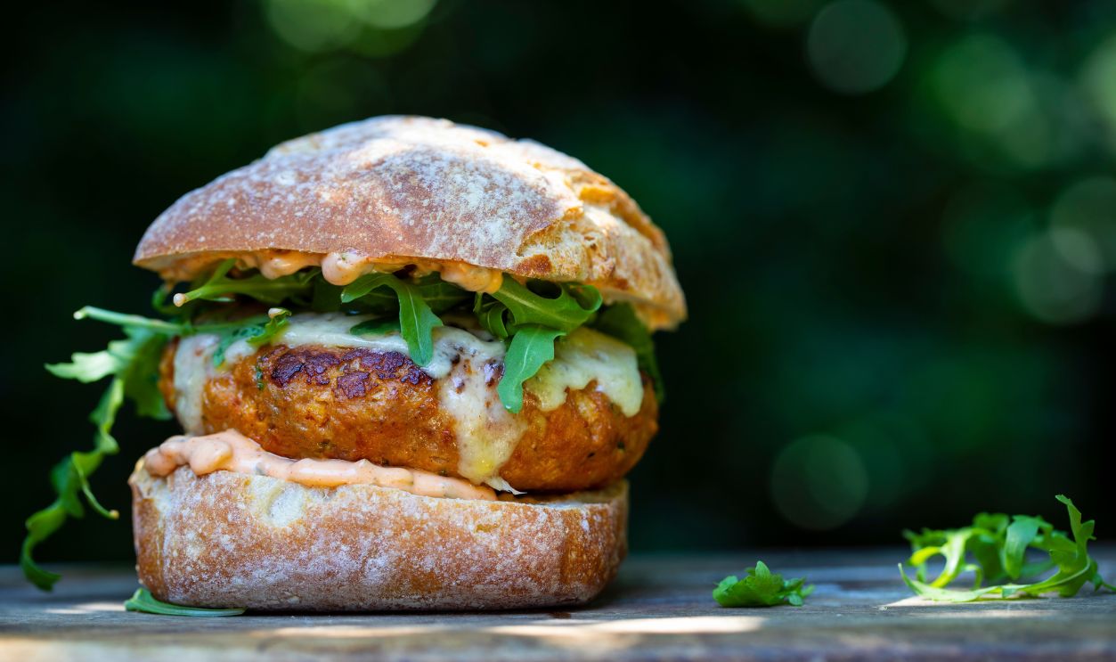 Pork and chorizo burger with cheese in a bun