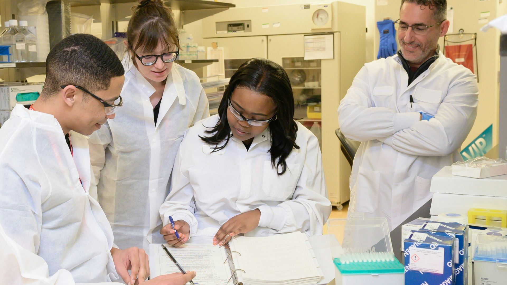 a group of people working in a lab