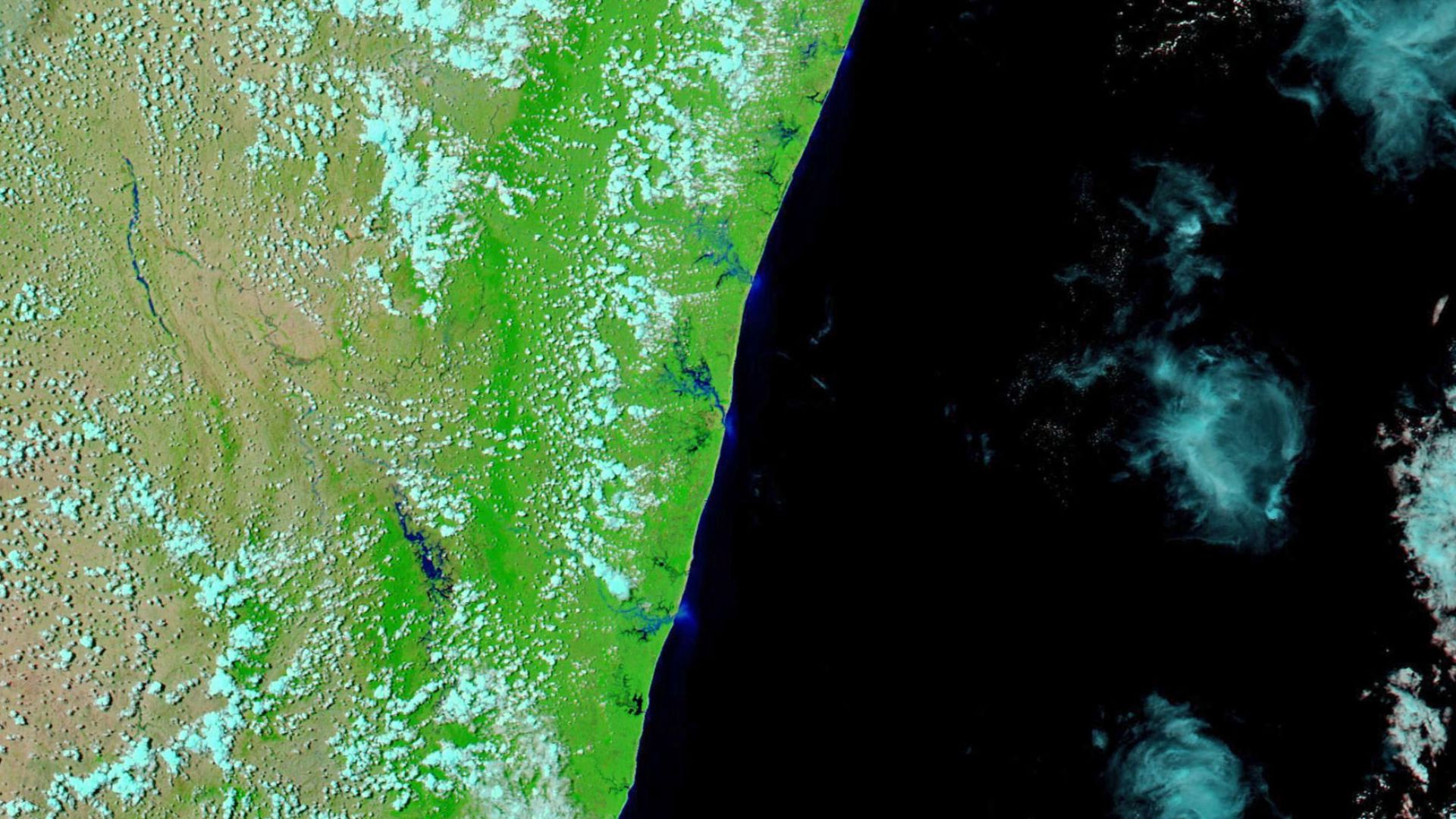 Flooding was visible on February 10 (above right) when the Moderate Resolution Imaging Spectroradiometer (MODIS) on NASA’s Aqua satellite passed over. In this comparison of false-color imagery, which uses MODIS bands 7-2-1, areas flooded with sediment-lad